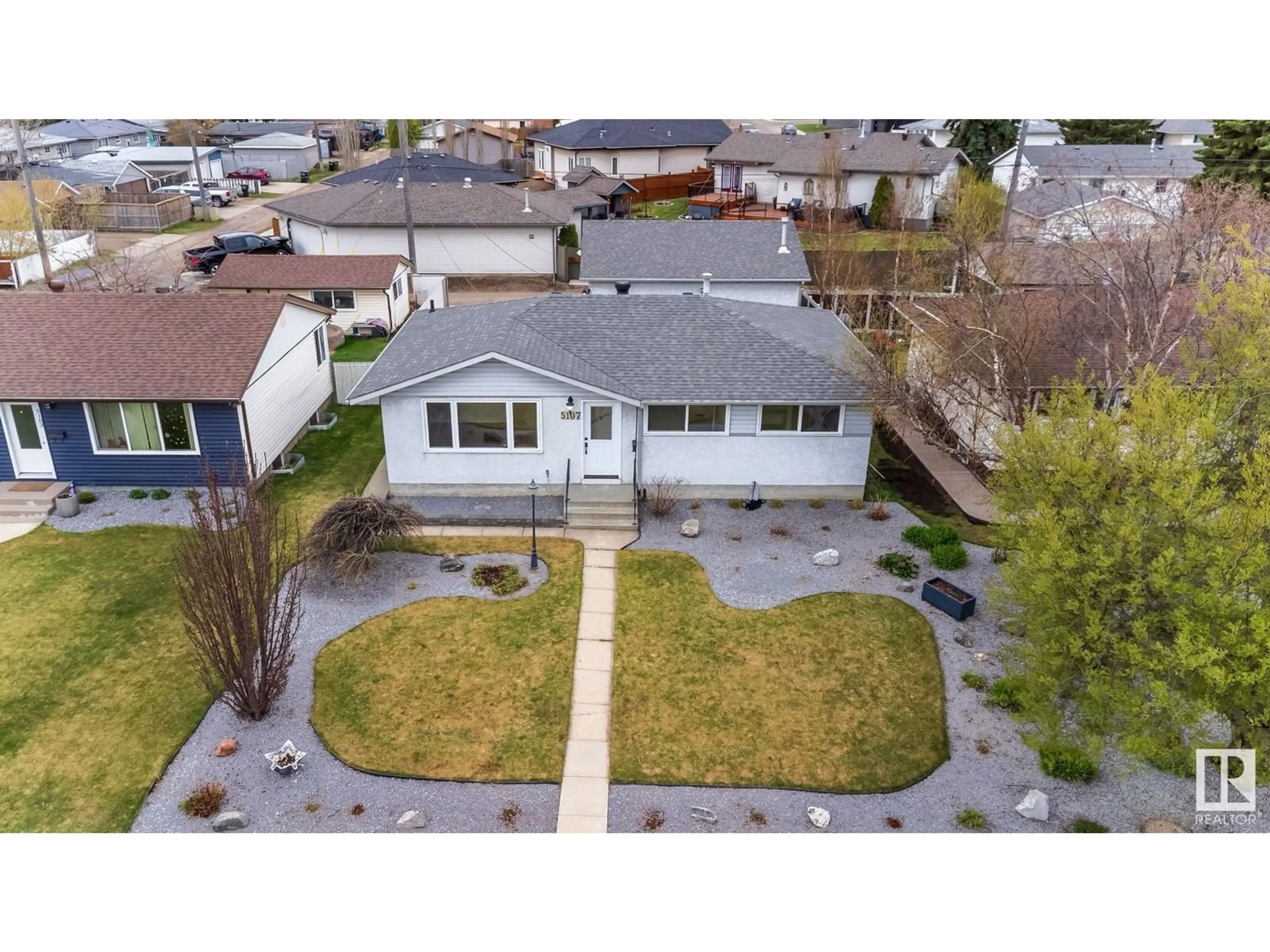 A pic from outside/outdoor area/front of a property/back of a property/a pic from drone, street for 5107 103 AV, Edmonton Alberta T6A0T1