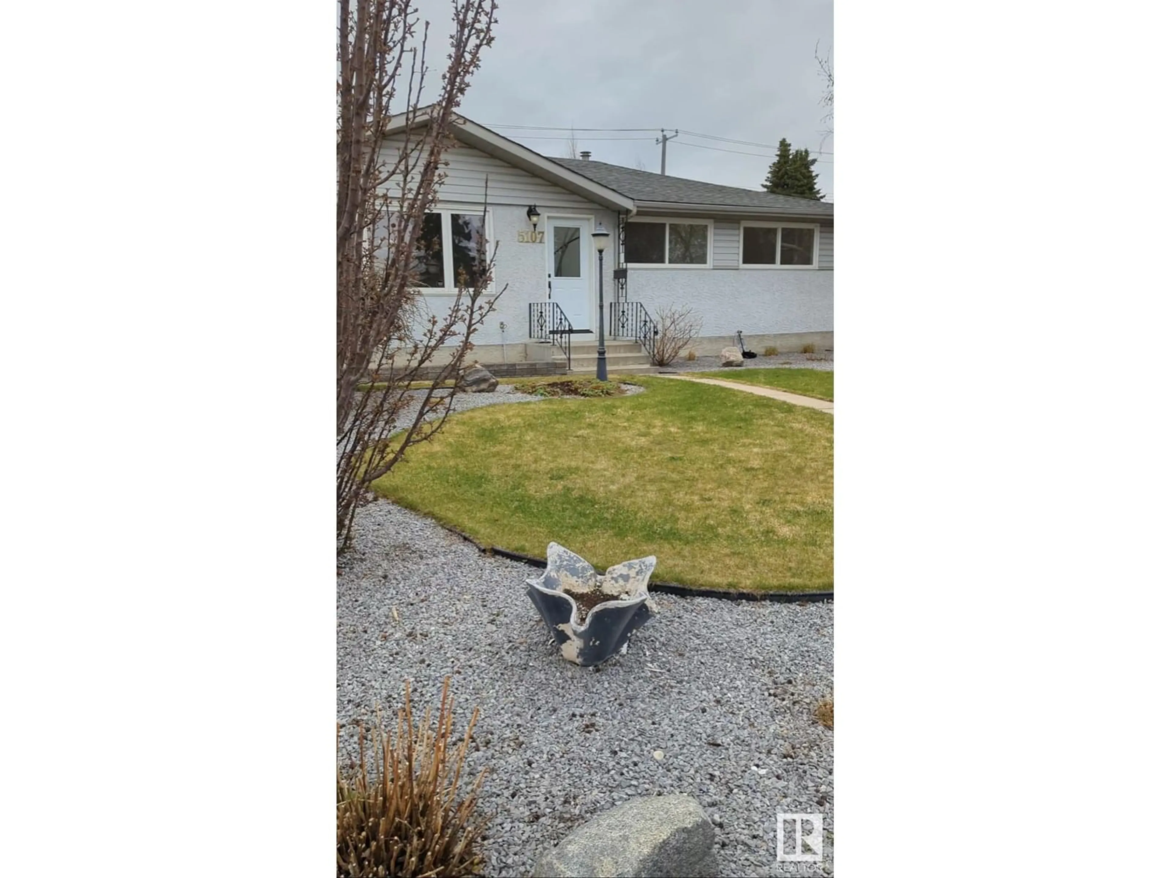 A pic from outside/outdoor area/front of a property/back of a property/a pic from drone, street for 5107 103 AV, Edmonton Alberta T6A0T1