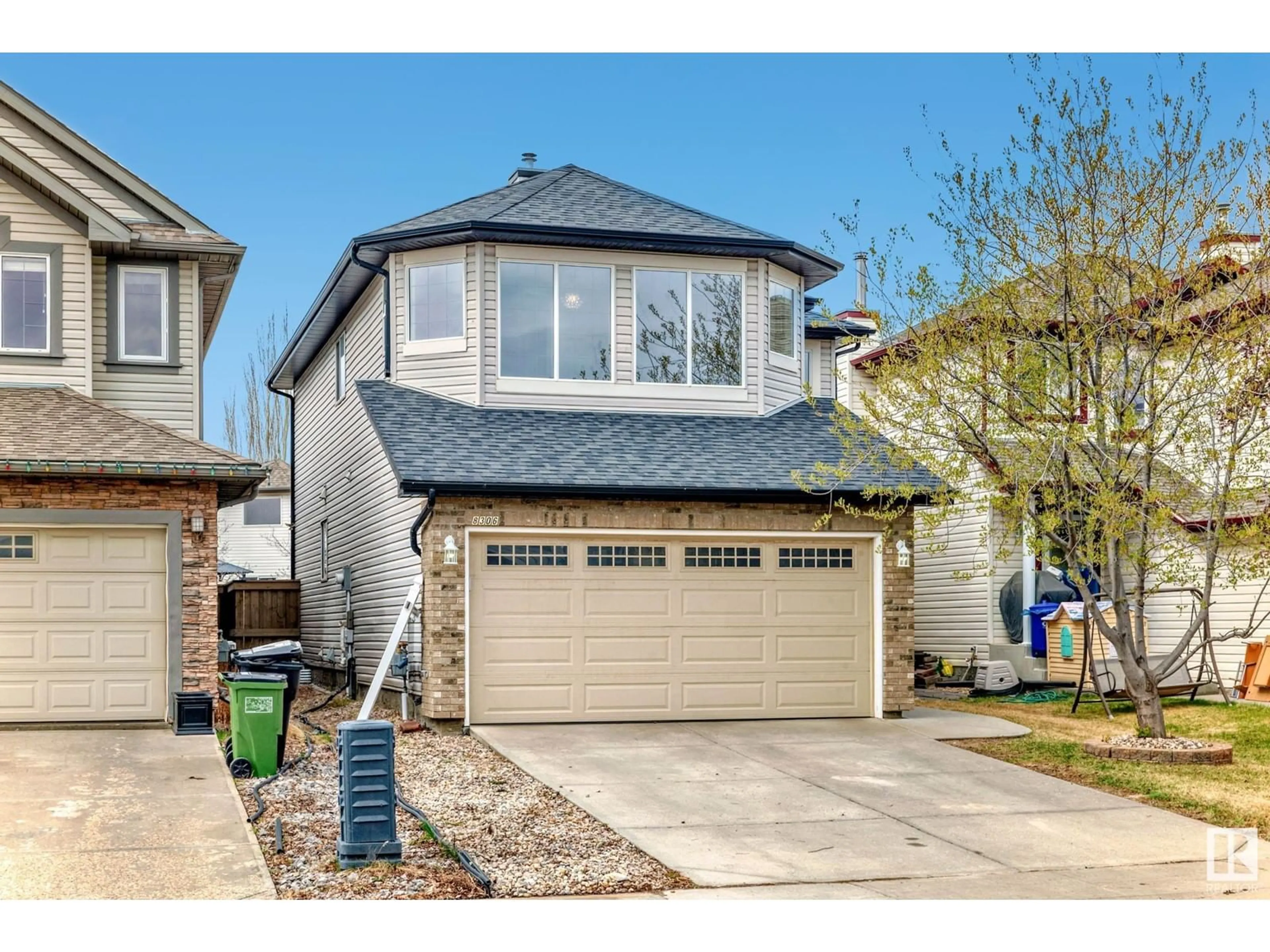 Home with vinyl exterior material, street for 8306 SHASKE CR, Edmonton Alberta T6R3V8