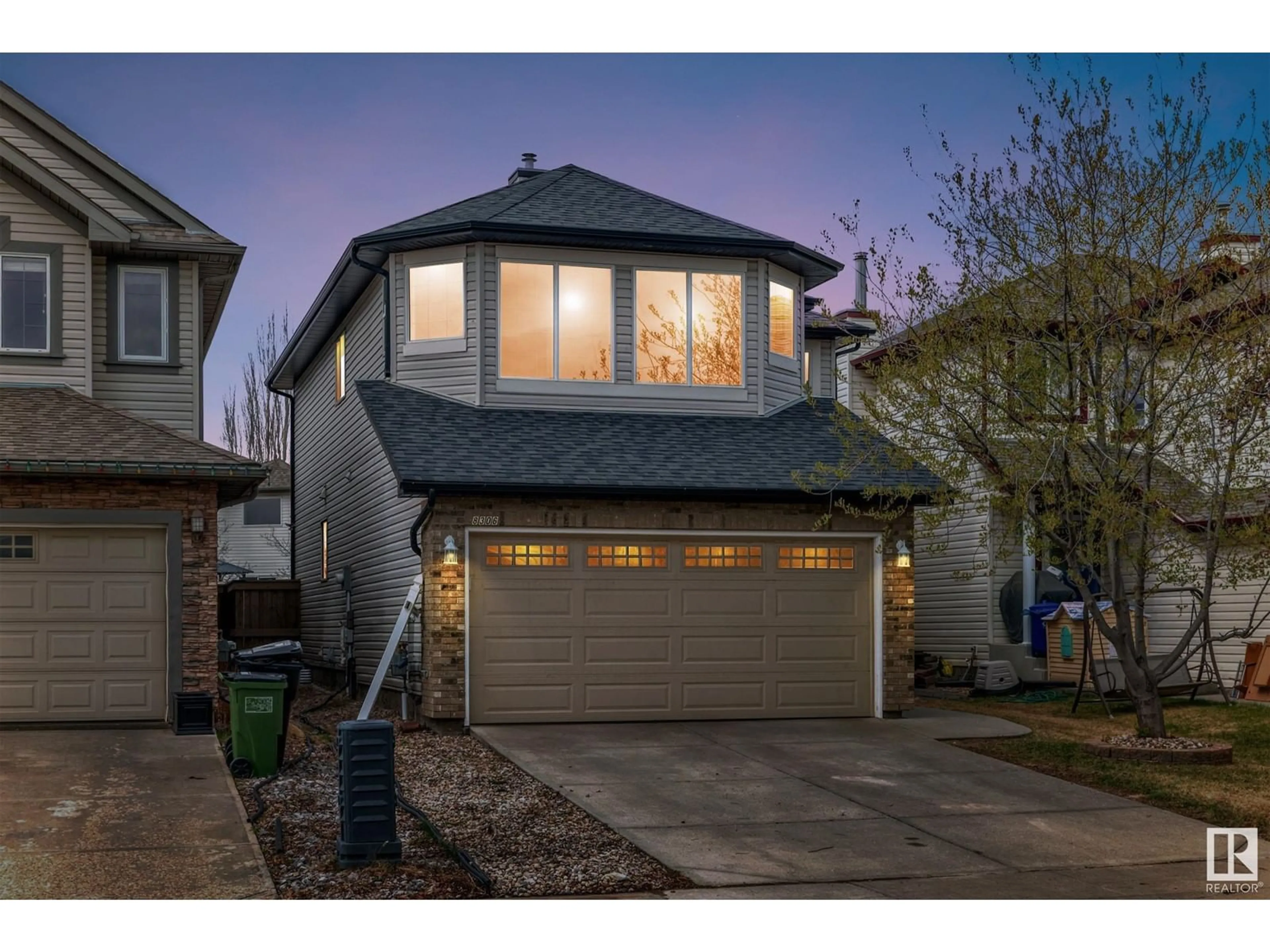 Home with vinyl exterior material, street for 8306 SHASKE CR, Edmonton Alberta T6R3V8