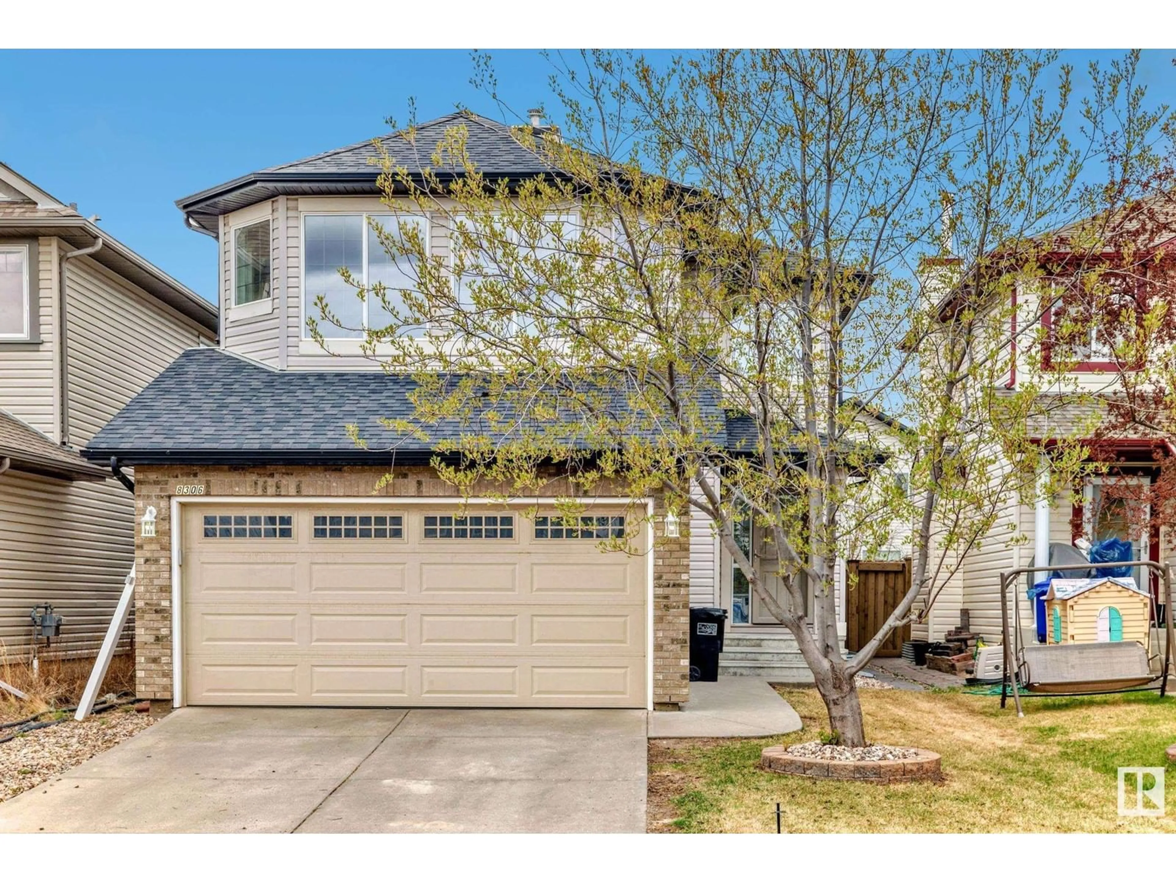 Home with vinyl exterior material, street for 8306 SHASKE CR, Edmonton Alberta T6R3V8