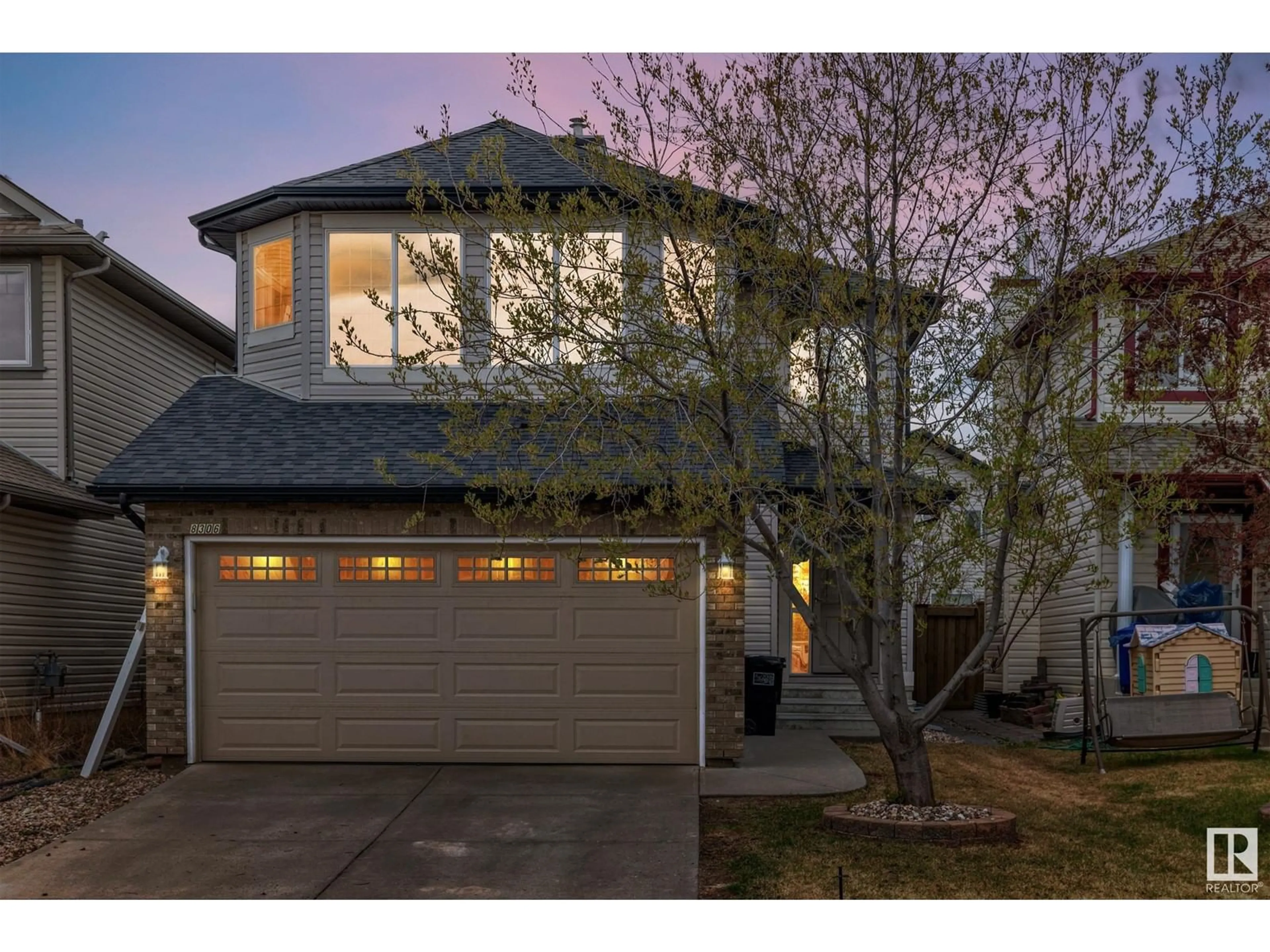 Home with vinyl exterior material, street for 8306 SHASKE CR, Edmonton Alberta T6R3V8