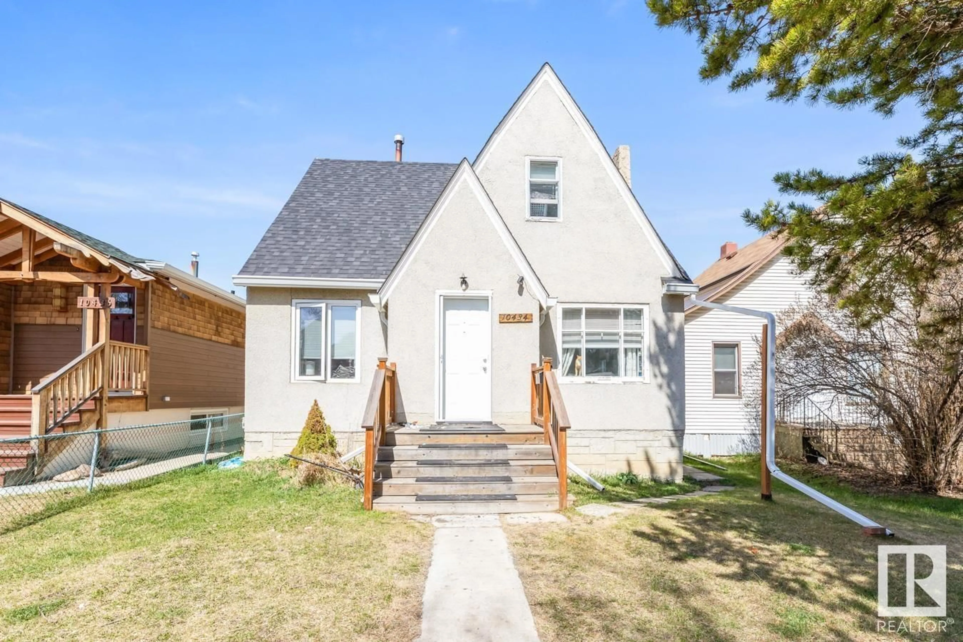 Home with vinyl exterior material, street for 10434 69 AV, Edmonton Alberta T6H2C3