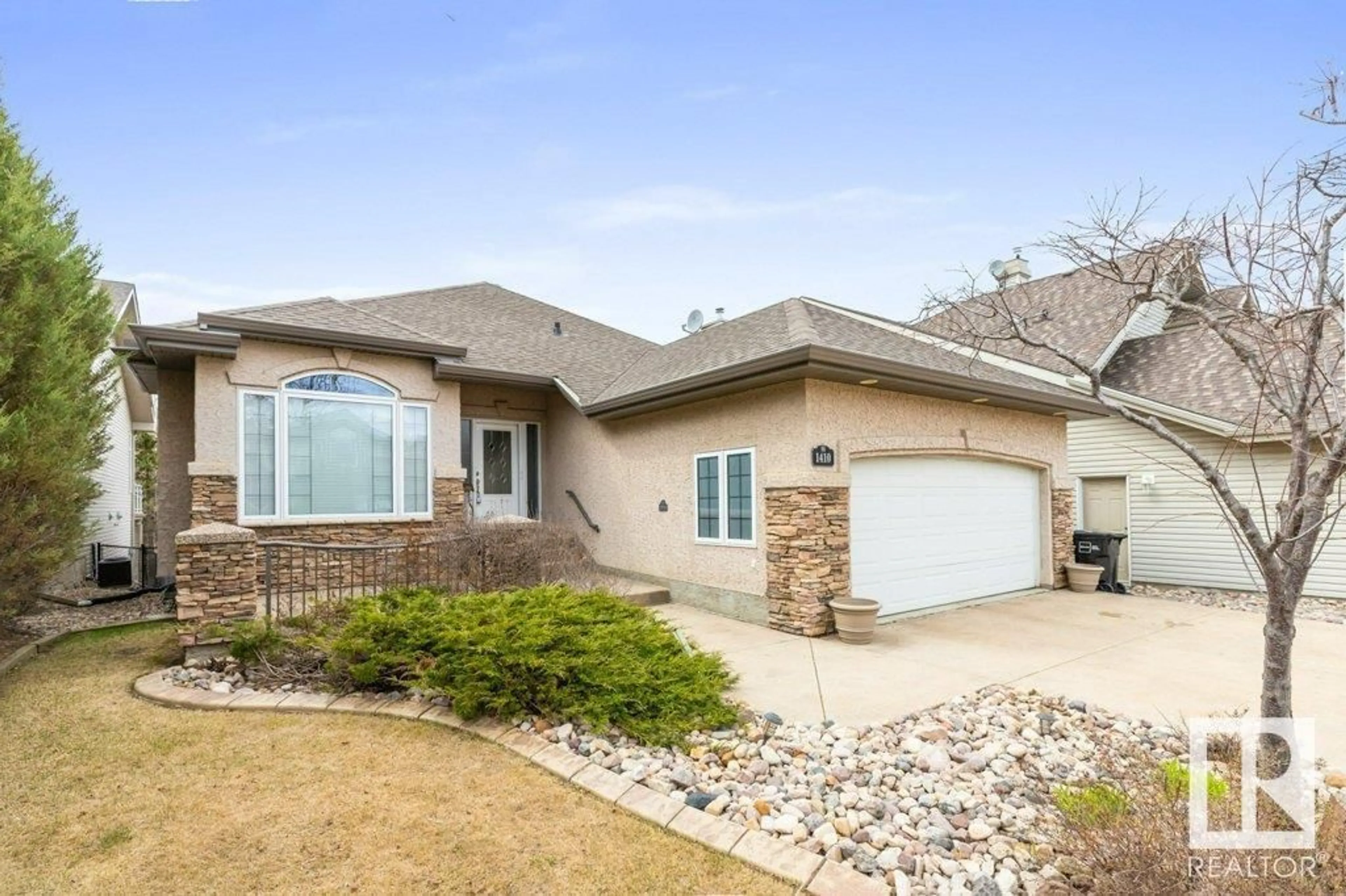 Home with vinyl exterior material, street for 1410 RUTHERFORD CO, Edmonton Alberta T6W1H7