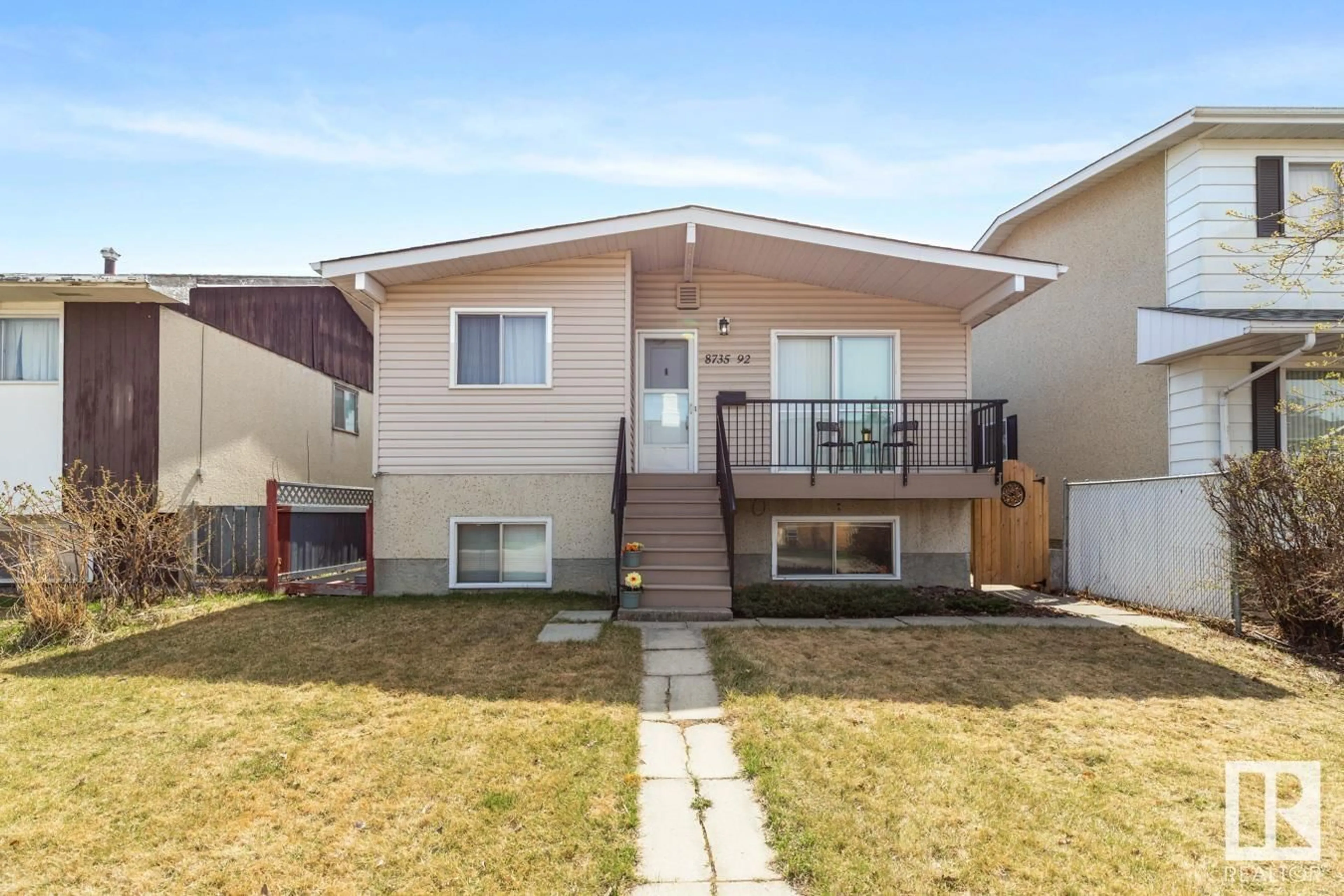 Home with vinyl exterior material, street for 8735 92 AV, Edmonton Alberta T6C1S2
