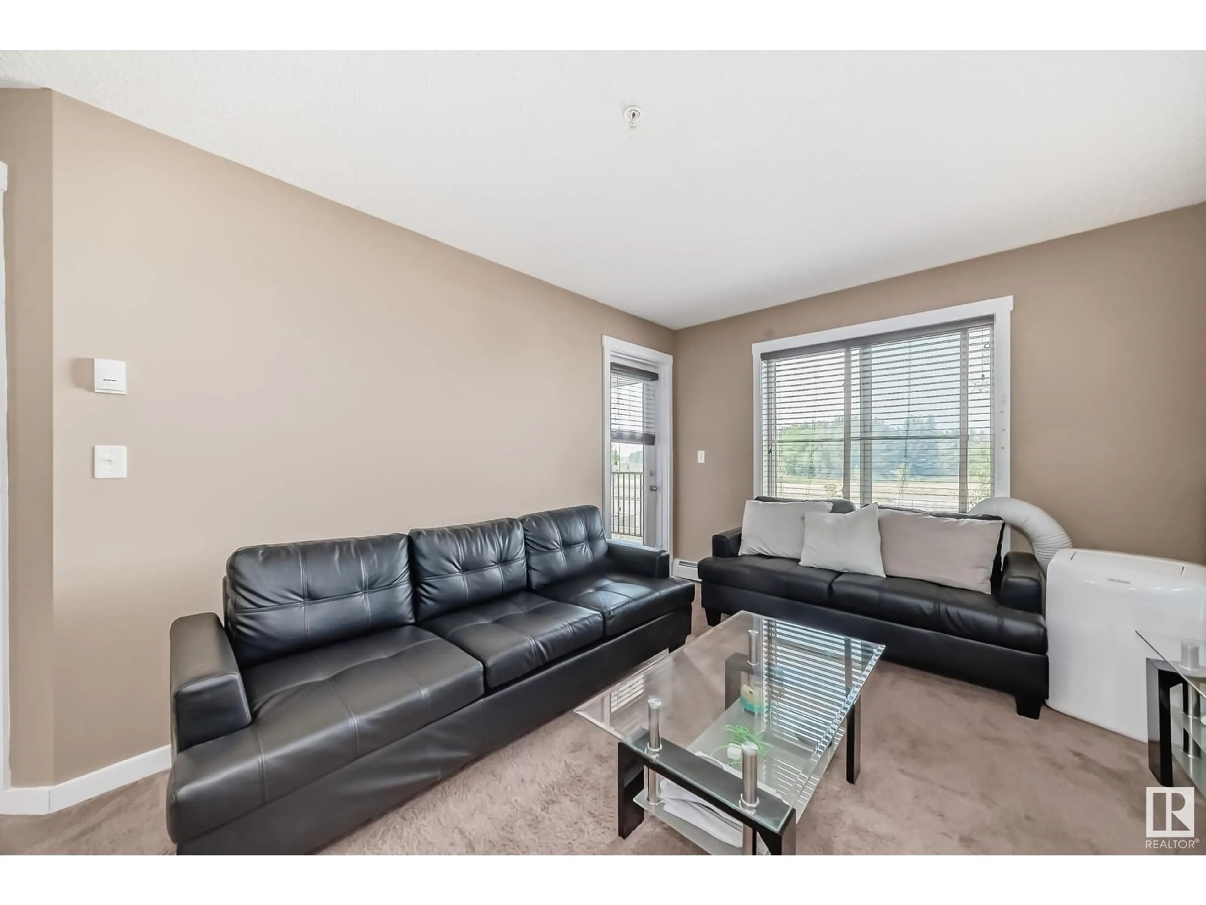 Living room with furniture, unknown for 209 - 3211 JAMES MOWATT TR, Edmonton Alberta T6W3L6