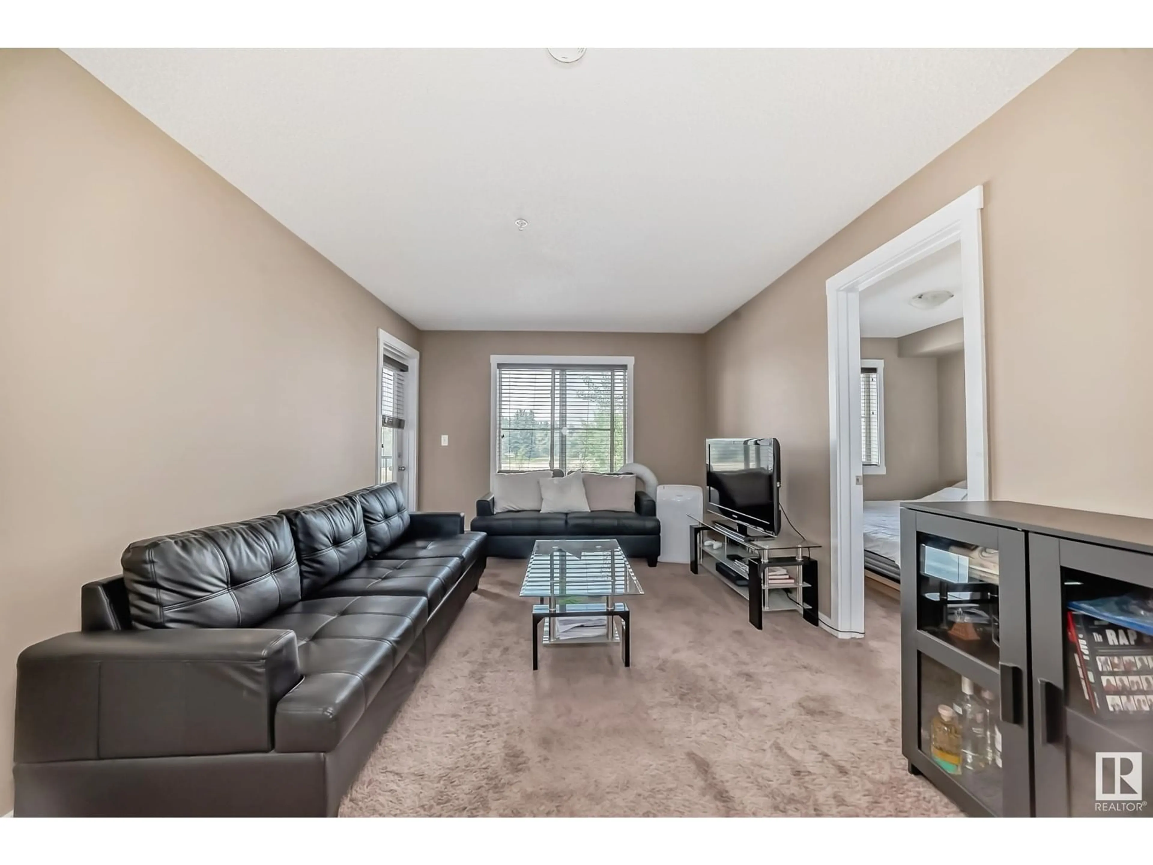 Living room with furniture, unknown for 209 - 3211 JAMES MOWATT TR, Edmonton Alberta T6W3L6