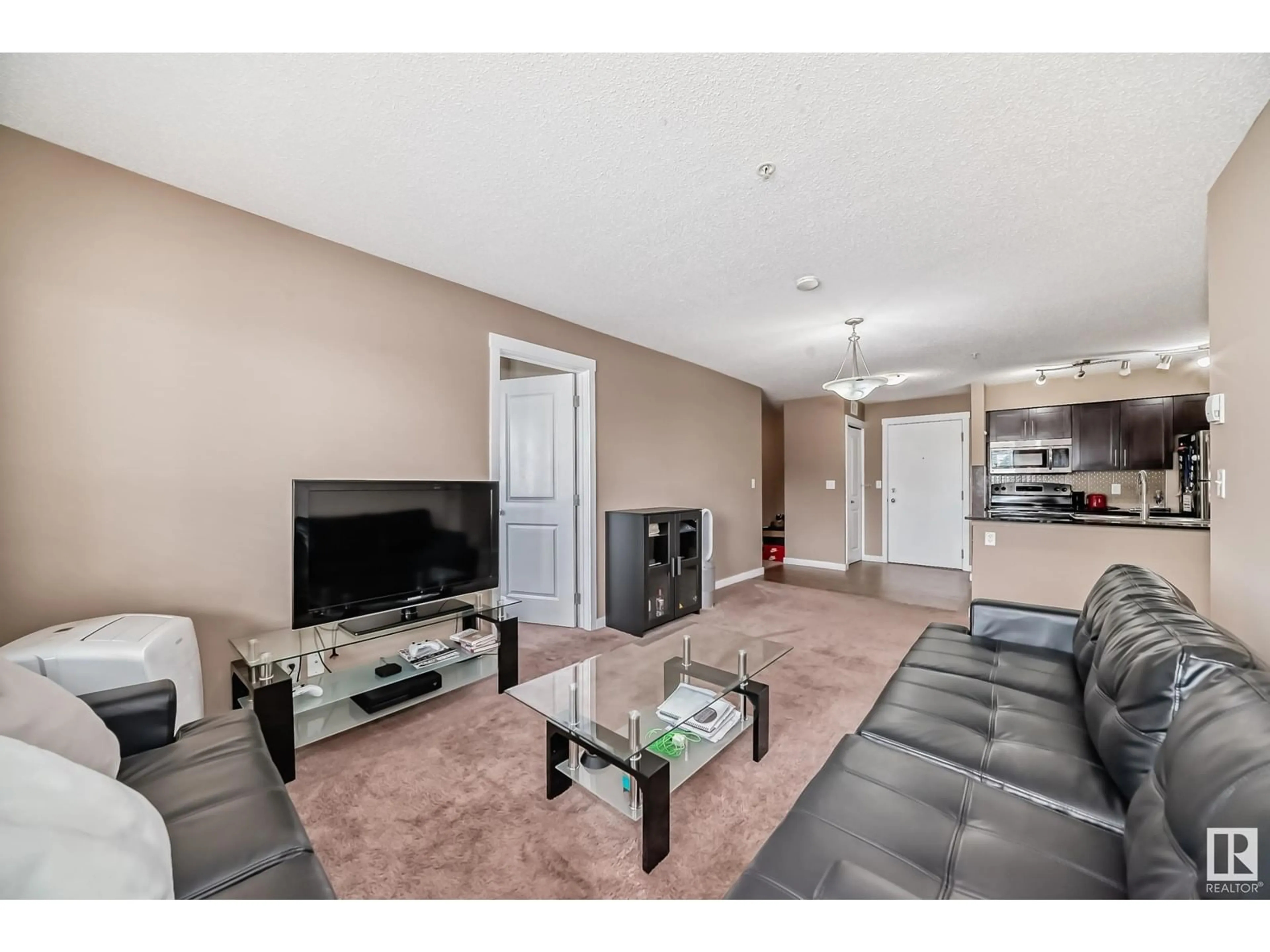 Living room with furniture, unknown for 209 - 3211 JAMES MOWATT TR, Edmonton Alberta T6W3L6