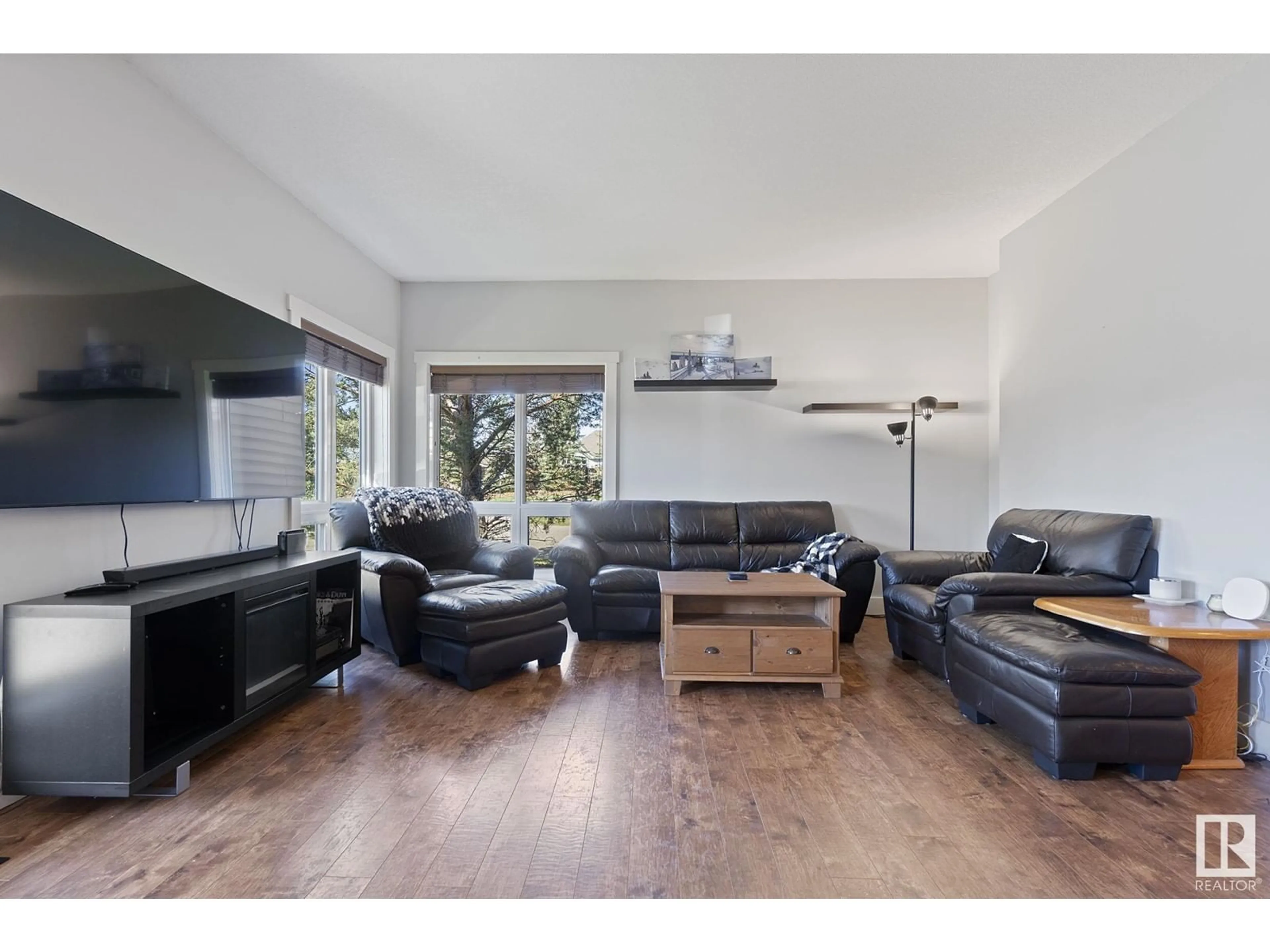 Living room with furniture, wood/laminate floor for 2102 GRAYBRIAR GR, Stony Plain Alberta T7Z0G1