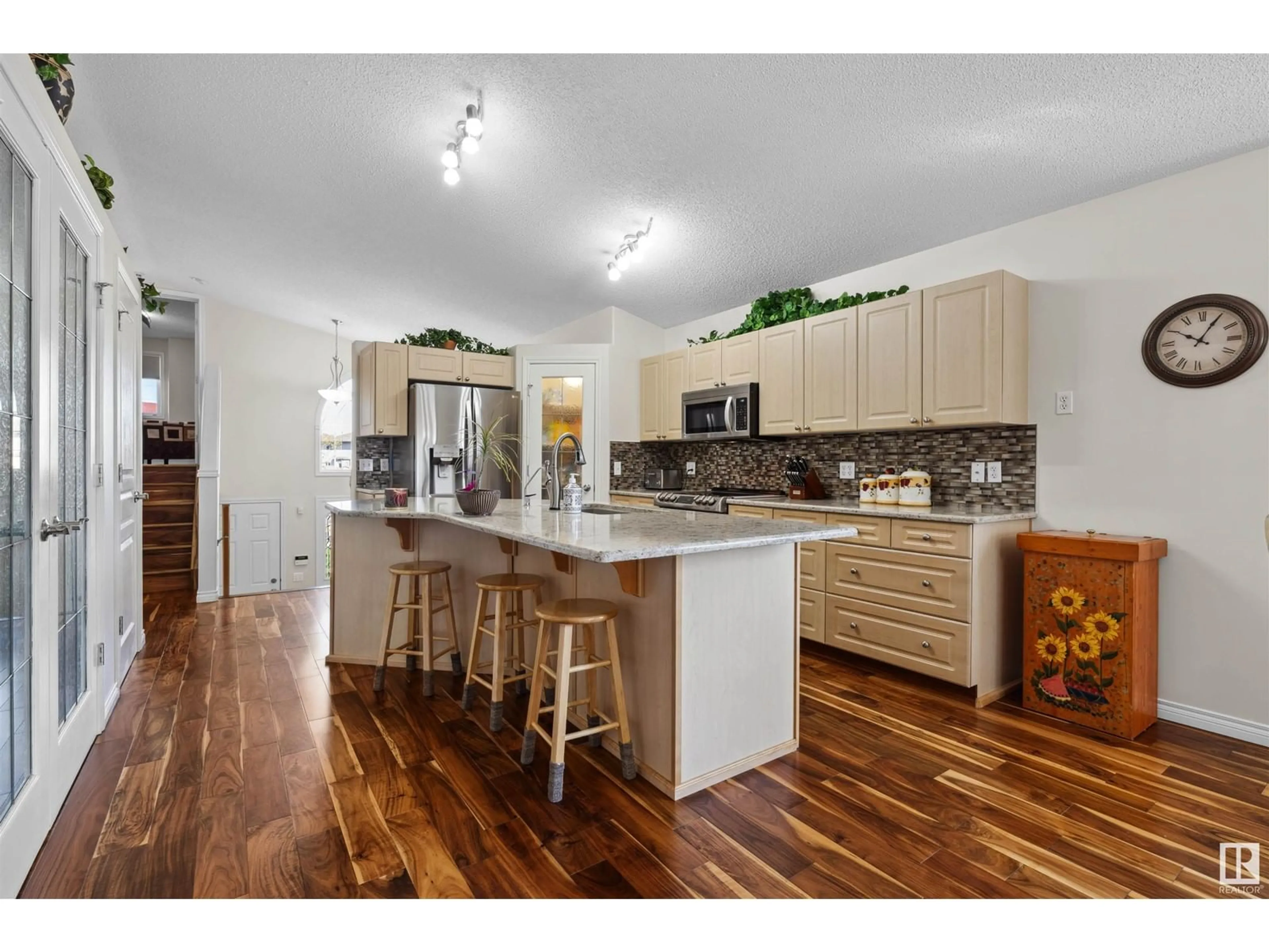 Open concept kitchen, wood/laminate floor for 15903 134 ST, Edmonton Alberta T6V1S4