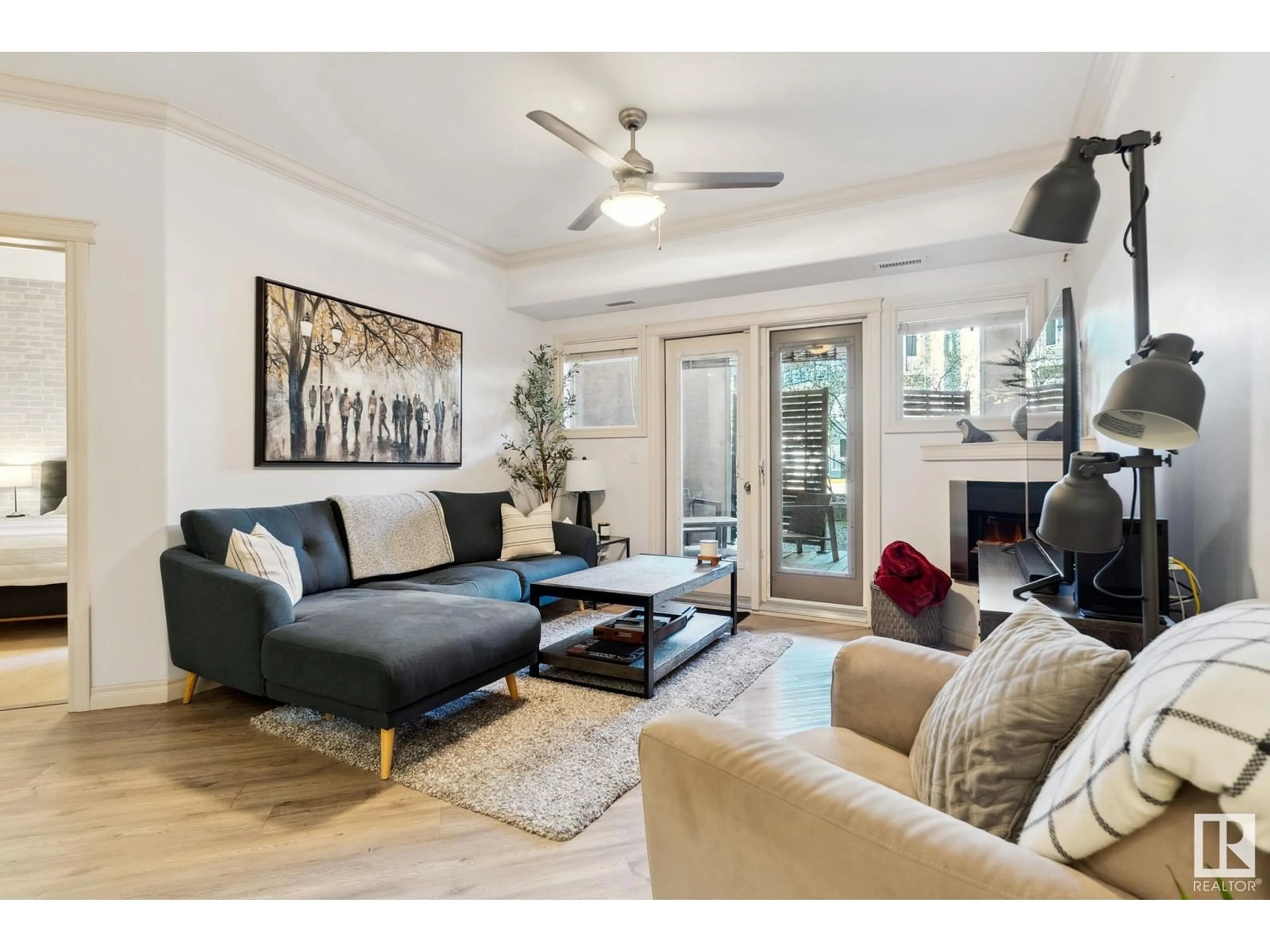 Living room with furniture, wood/laminate floor for #133 - 10121 80 AV, Edmonton Alberta T6E0B9
