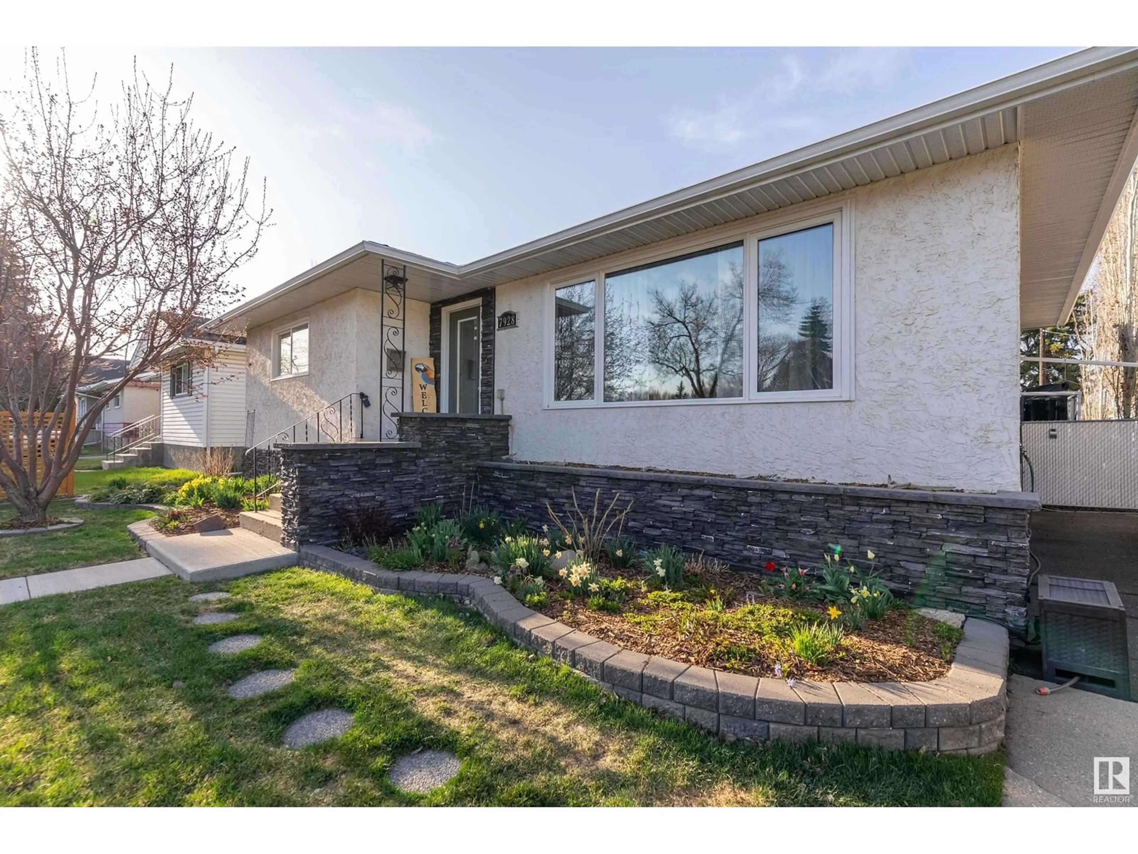 Home with brick exterior material, street for 7928 98 AV, Edmonton Alberta T6A0B4
