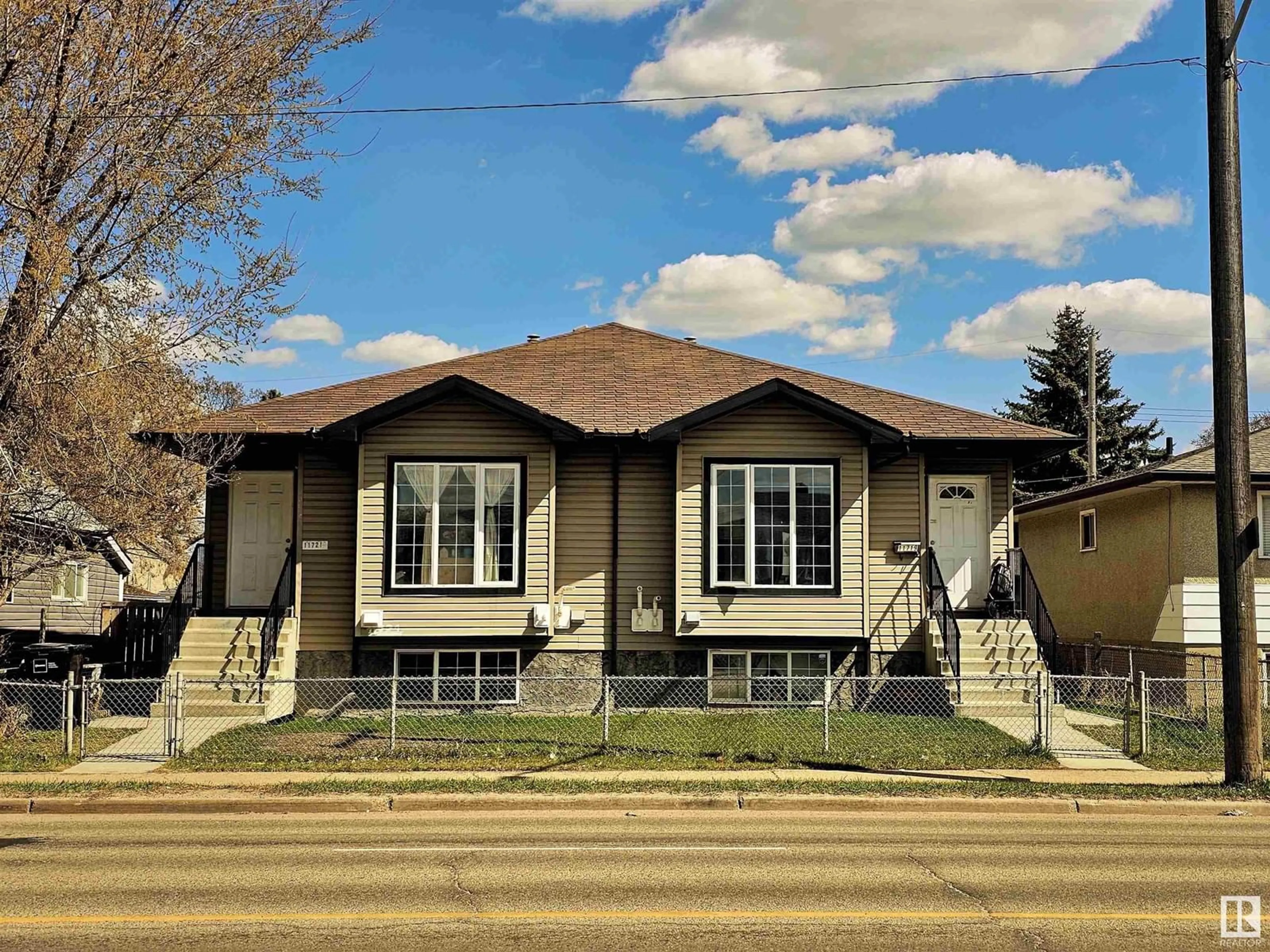Home with vinyl exterior material, street for 11721 80 ST, Edmonton Alberta T5B2N4