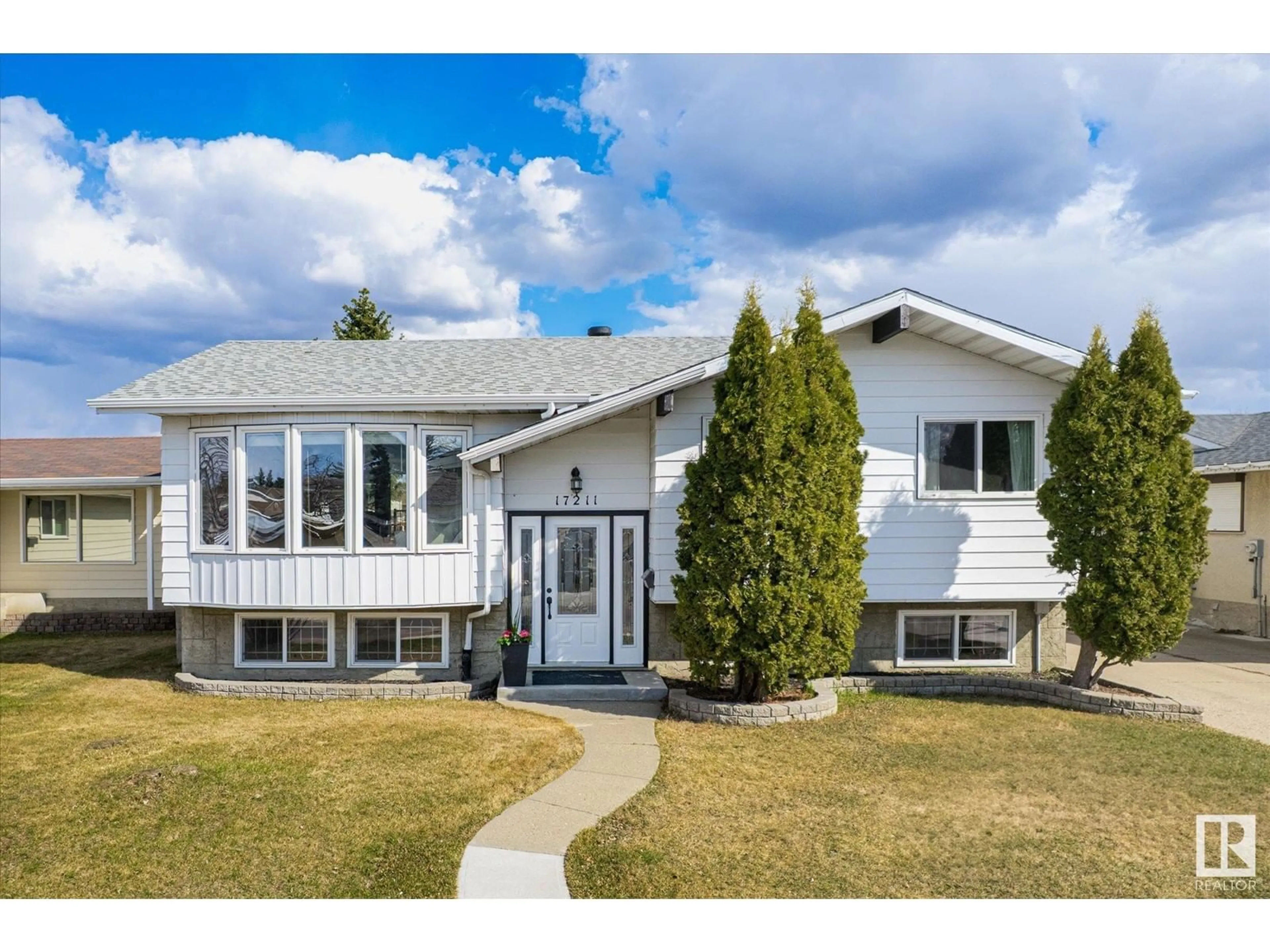 Home with vinyl exterior material, street for 17211 107 ST, Edmonton Alberta T5X3H5