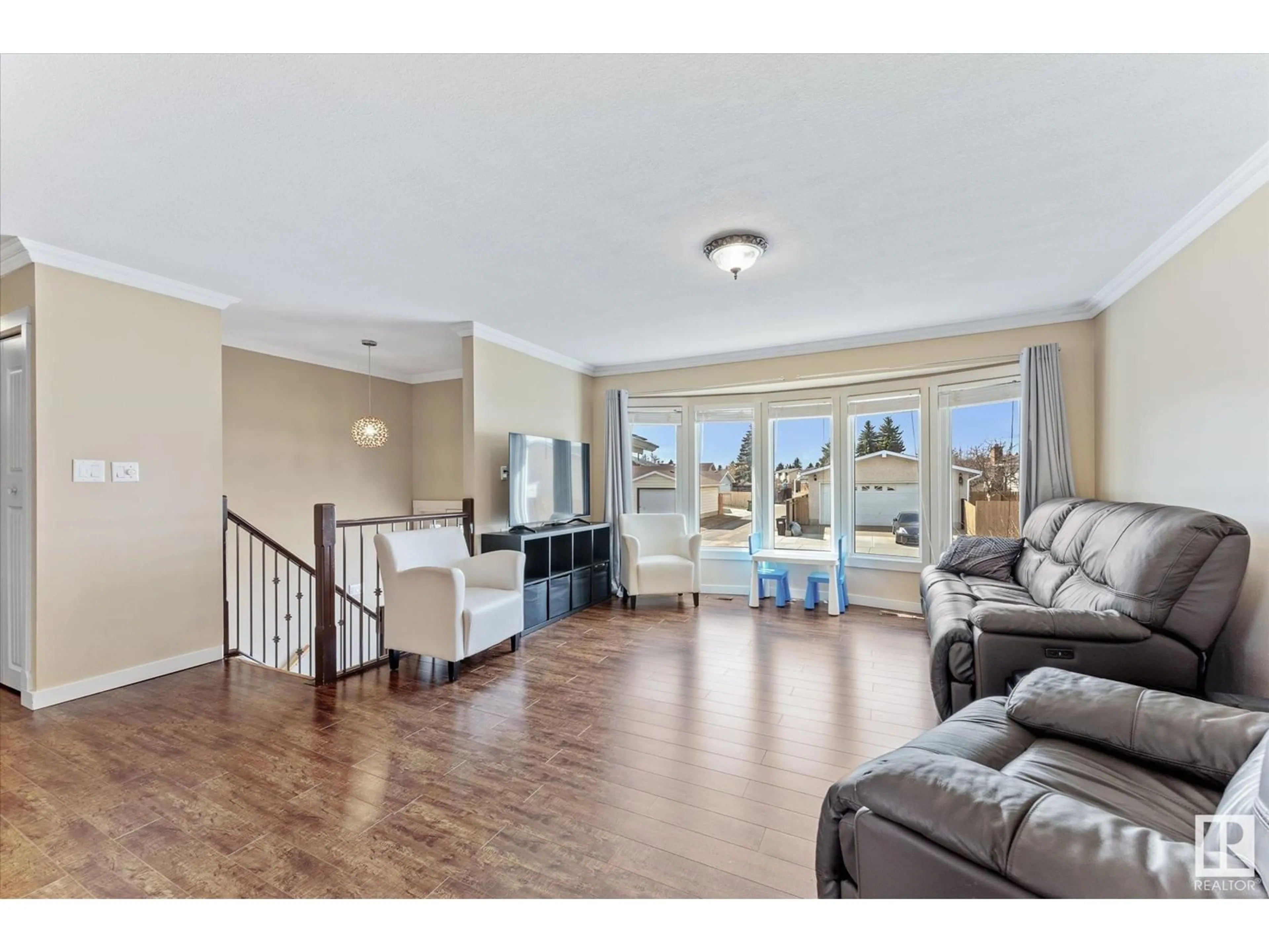 Living room with furniture, wood/laminate floor for 17211 107 ST, Edmonton Alberta T5X3H5