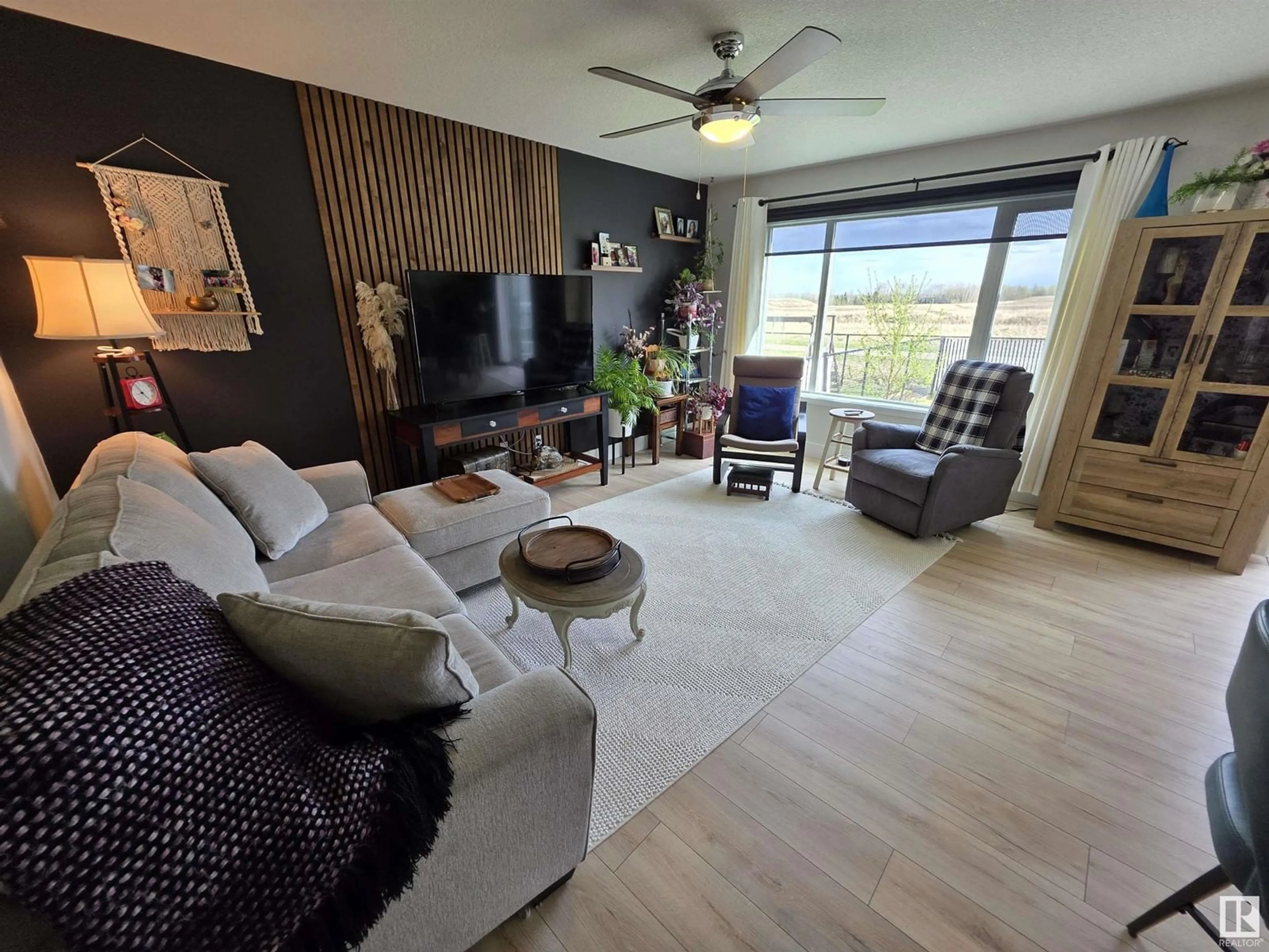 Living room with furniture, wood/laminate floor for 4019 41B AV, Drayton Valley Alberta T7A0B5