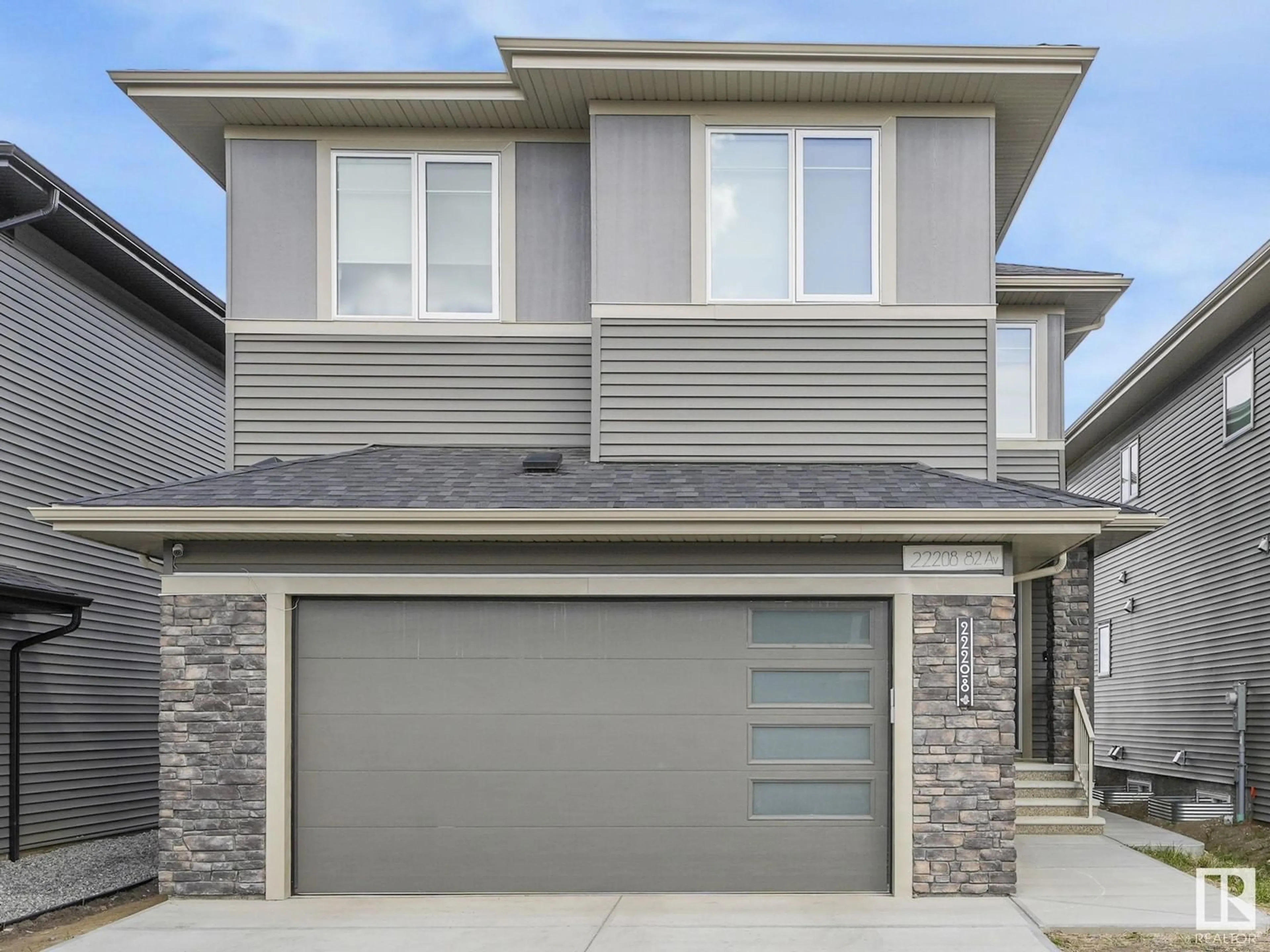 Home with vinyl exterior material, street for 22208 82 AV, Edmonton Alberta T5J1Y8