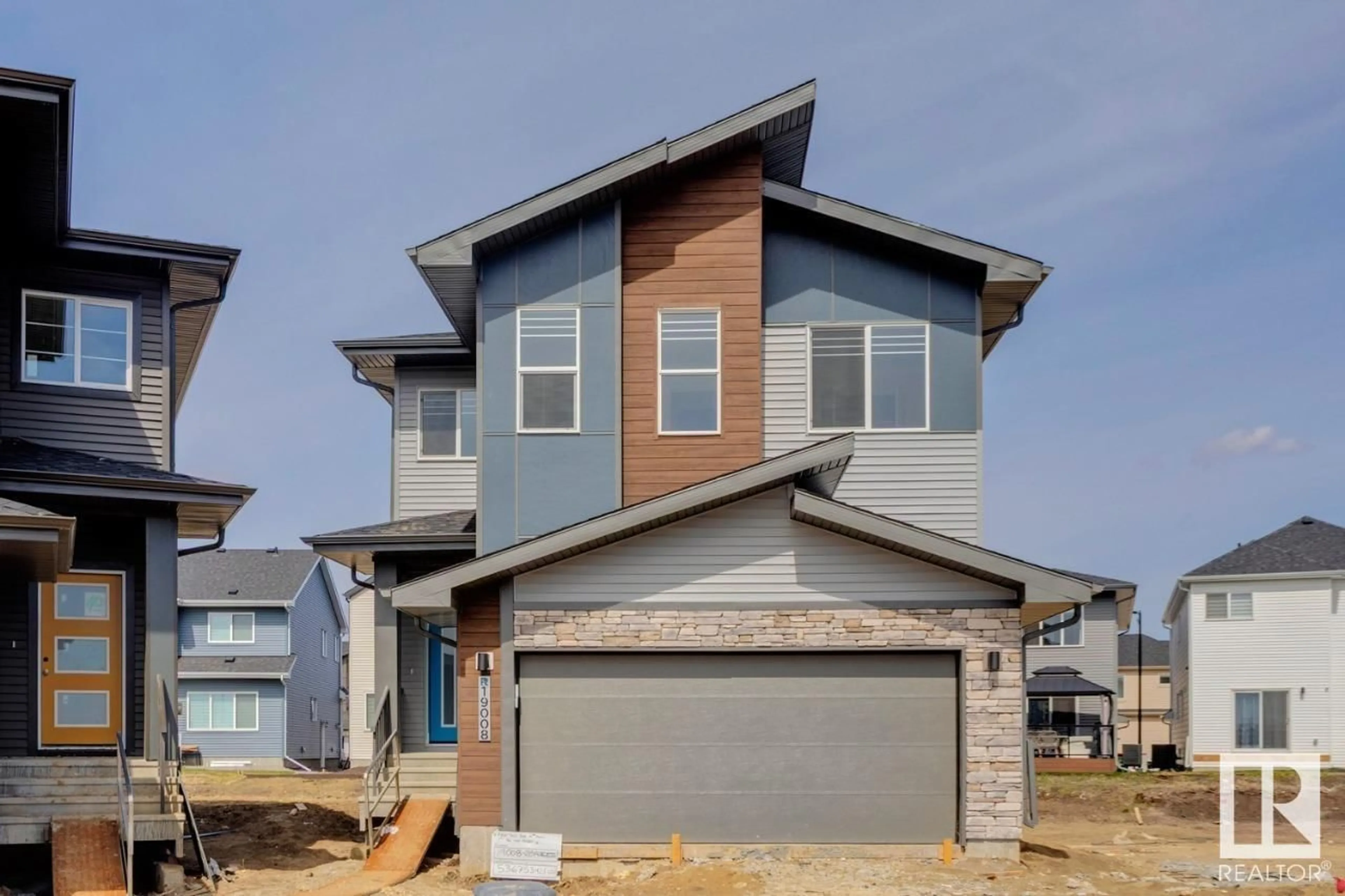 Home with vinyl exterior material, street for NW - 19008 20 AV, Edmonton Alberta T6M3A7