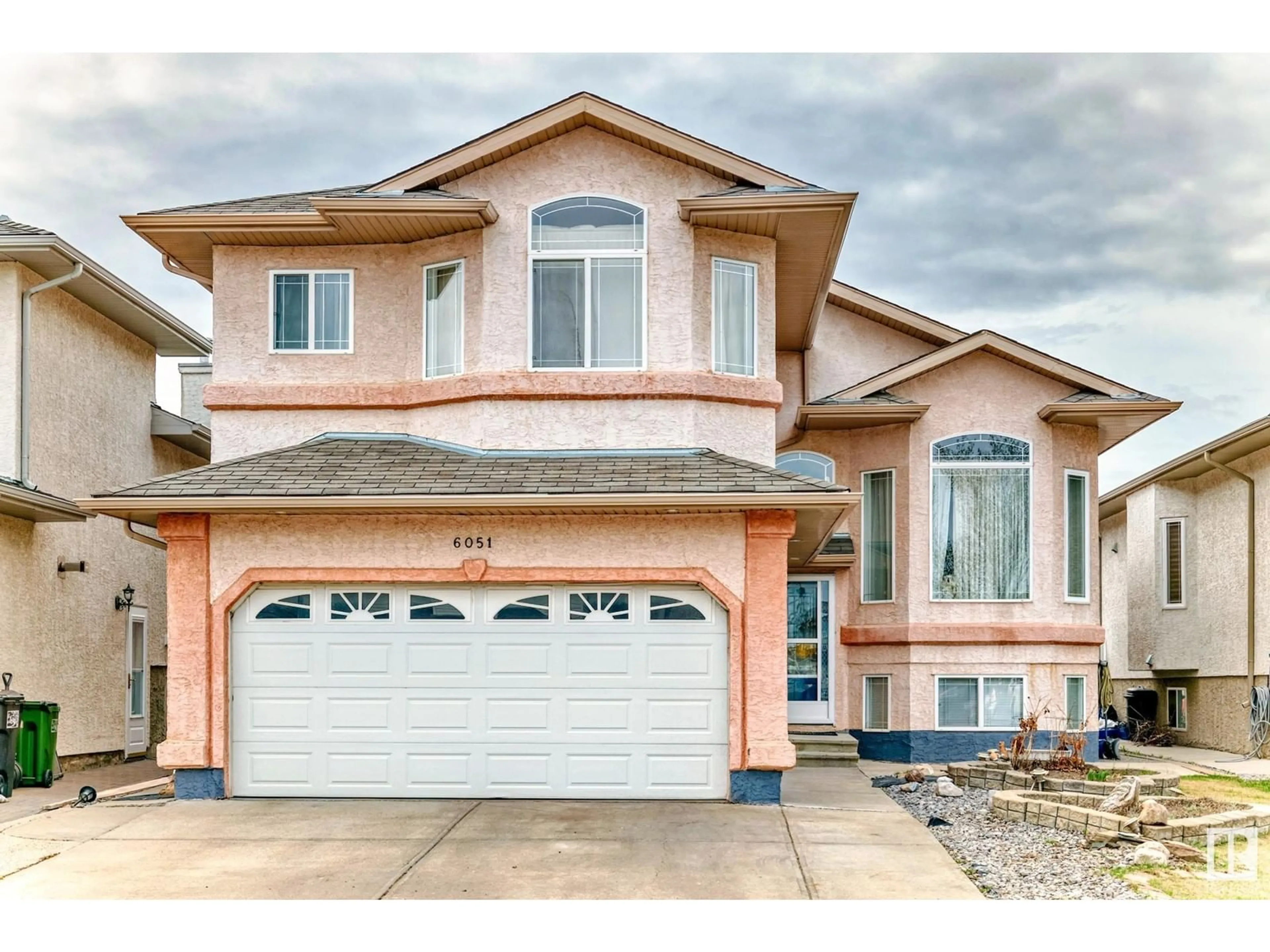 Home with vinyl exterior material, street for 6051 165 AV, Edmonton Alberta T5Y0A8
