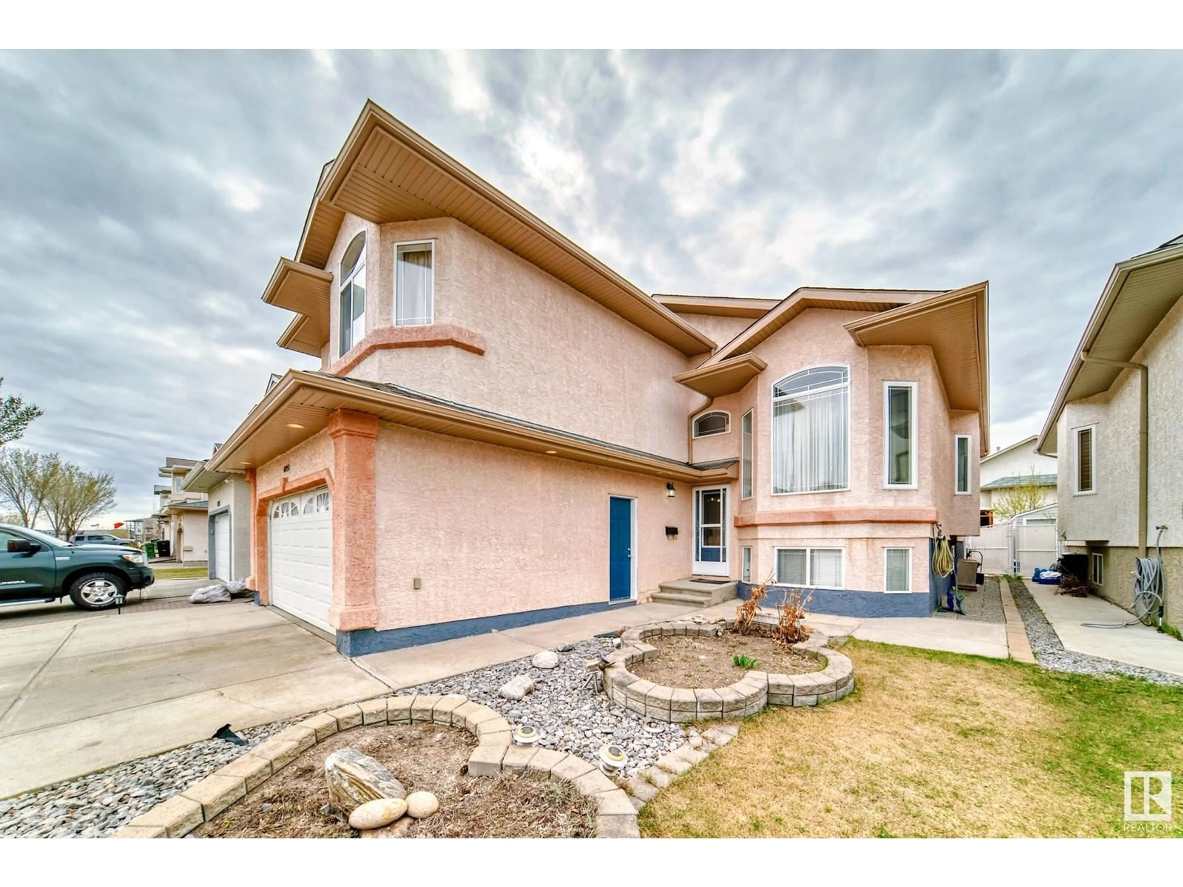 Home with vinyl exterior material, street for 6051 165 AV, Edmonton Alberta T5Y0A8