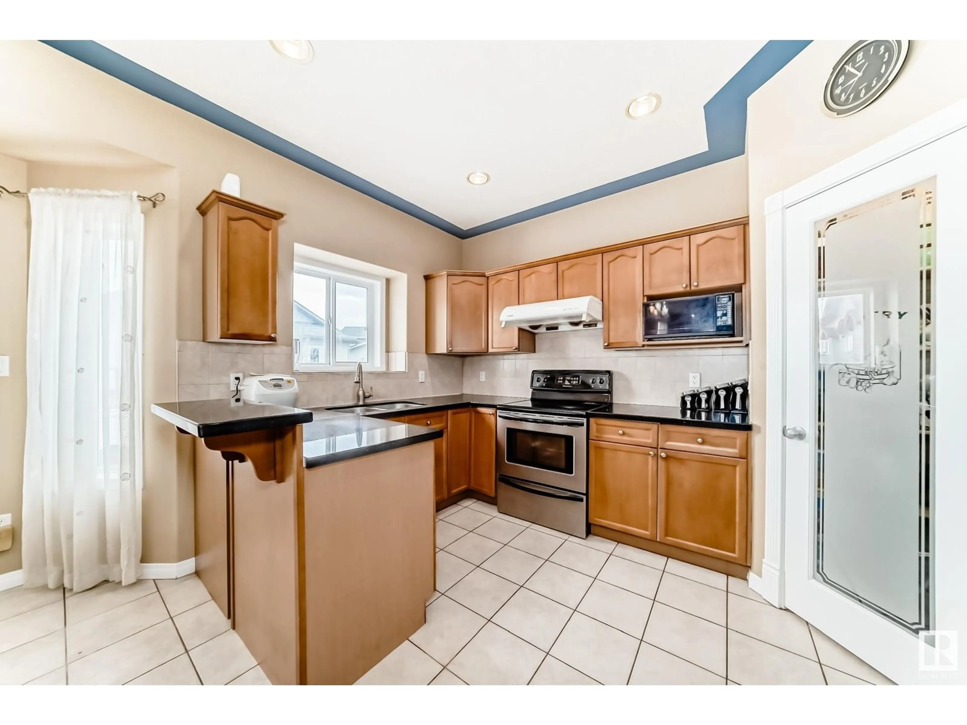 Standard kitchen, ceramic/tile floor for 6051 165 AV, Edmonton Alberta T5Y0A8