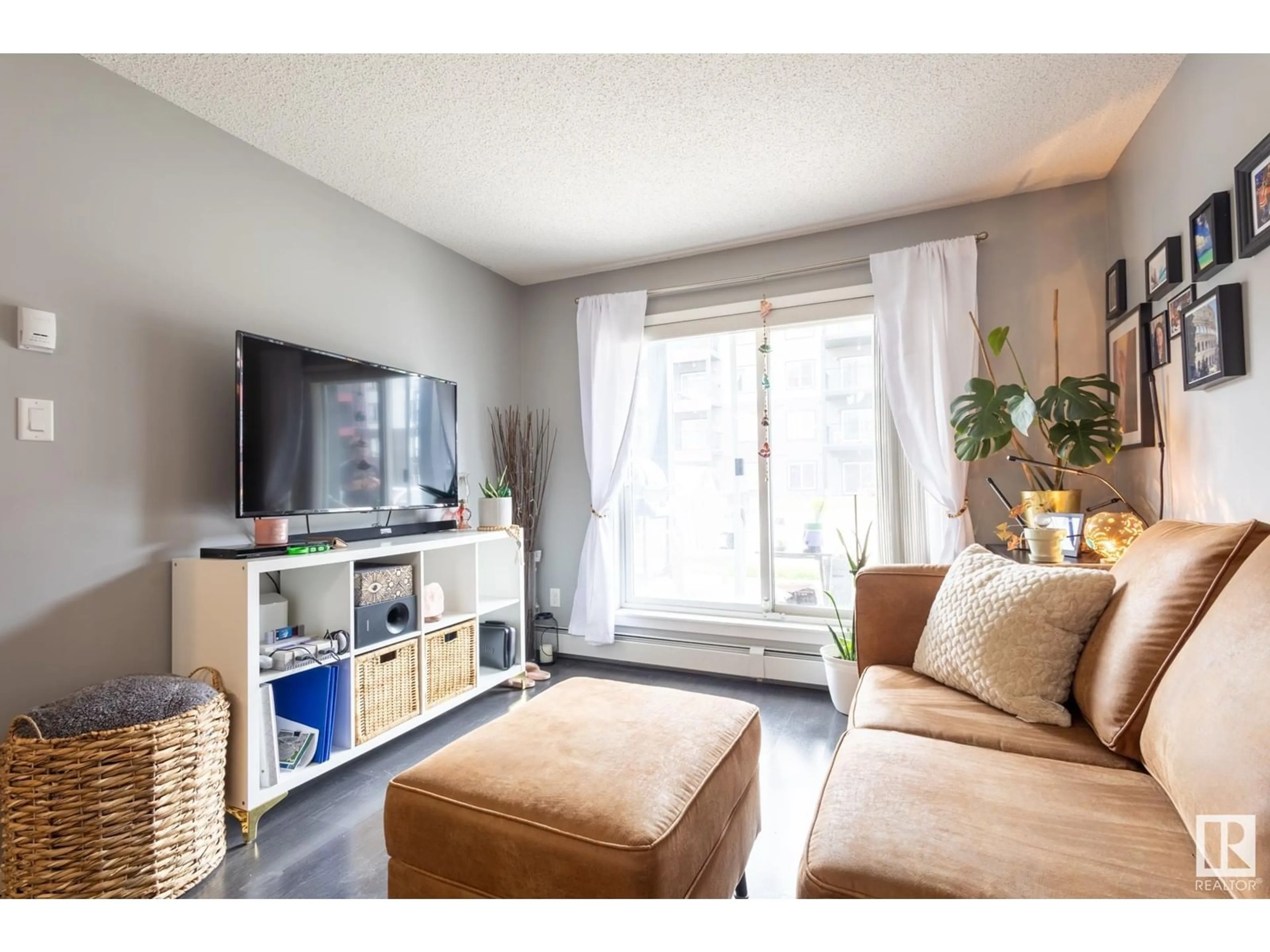 Living room with furniture, wood/laminate floor for 348 - 141 WINDERMERE RD, Edmonton Alberta T6W2P2