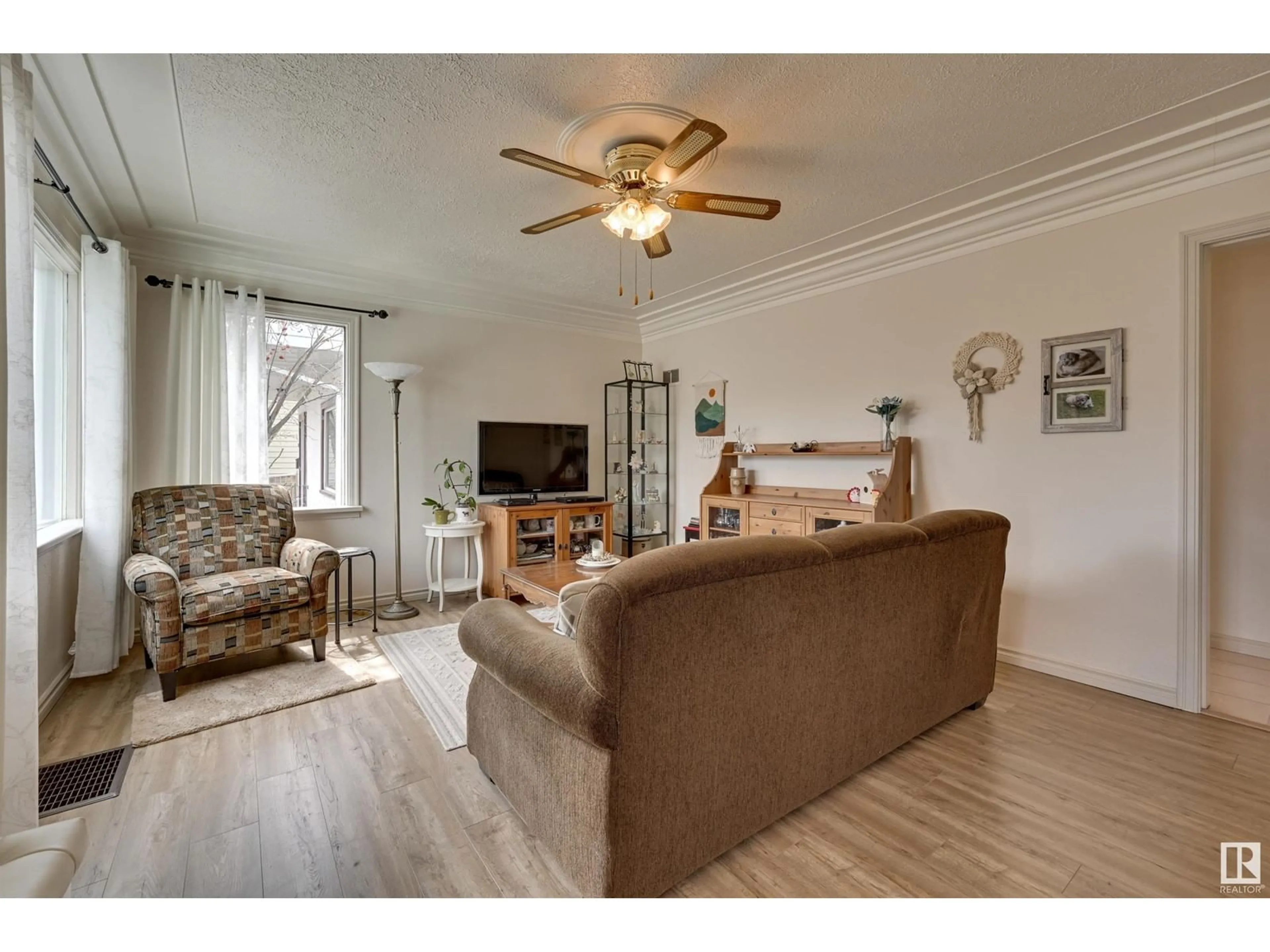 Living room with furniture, wood/laminate floor for 10230 147 ST, Edmonton Alberta T5N3B9
