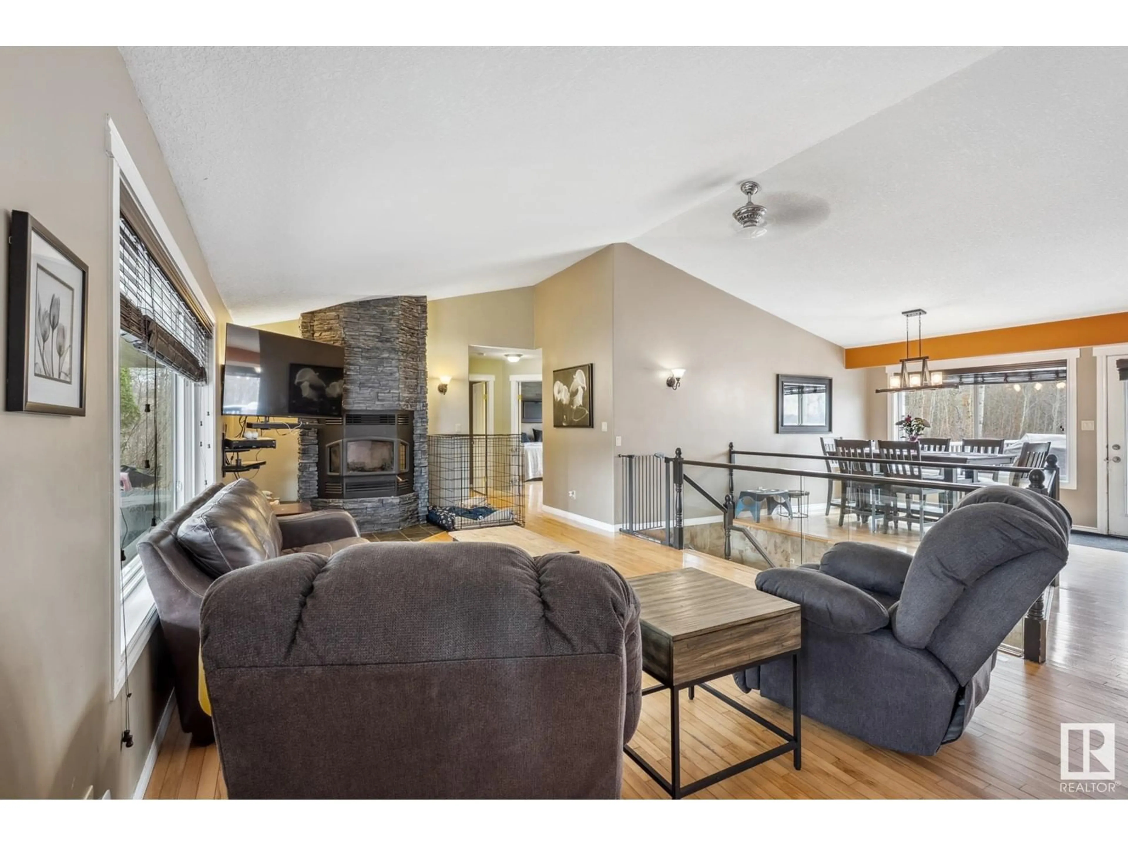 Living room with furniture, wood/laminate floor for 52465 - 386 RGE ROAD 213 RGE ROAD, Rural Strathcona County Alberta T8G2E7