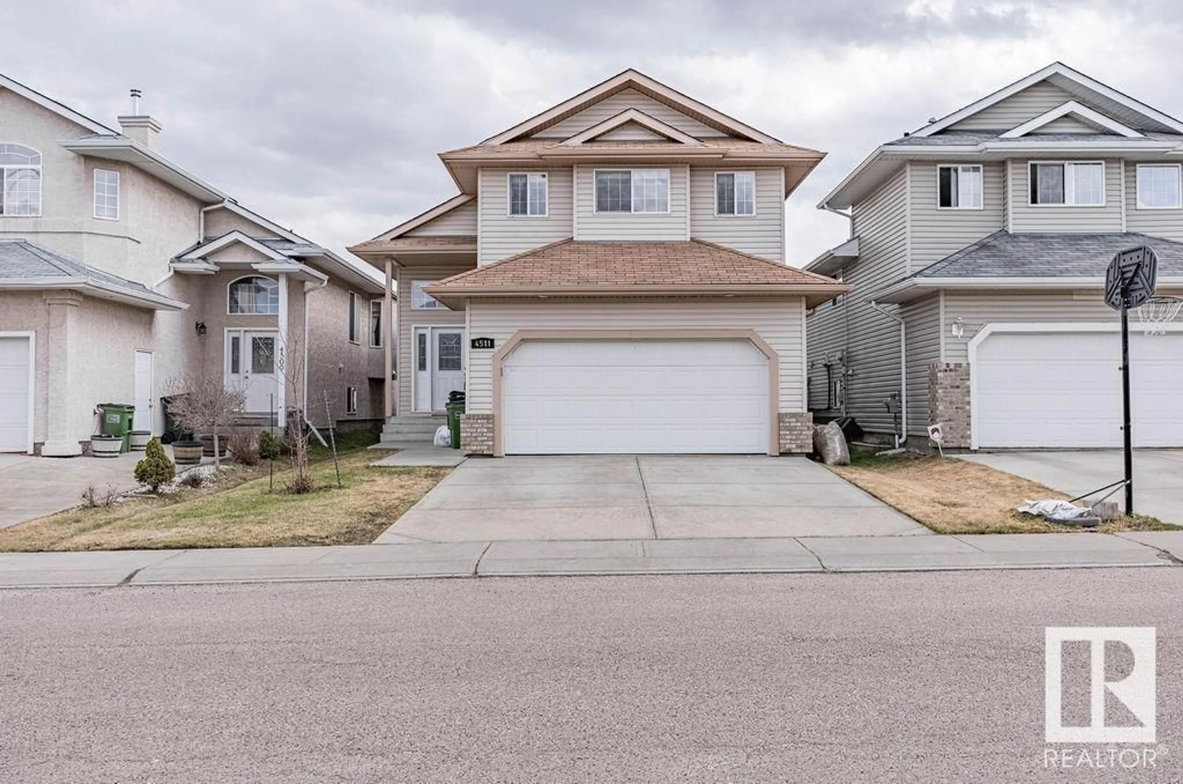 Home with vinyl exterior material, street for 4511 164A AV, Edmonton Alberta T5Y0C7