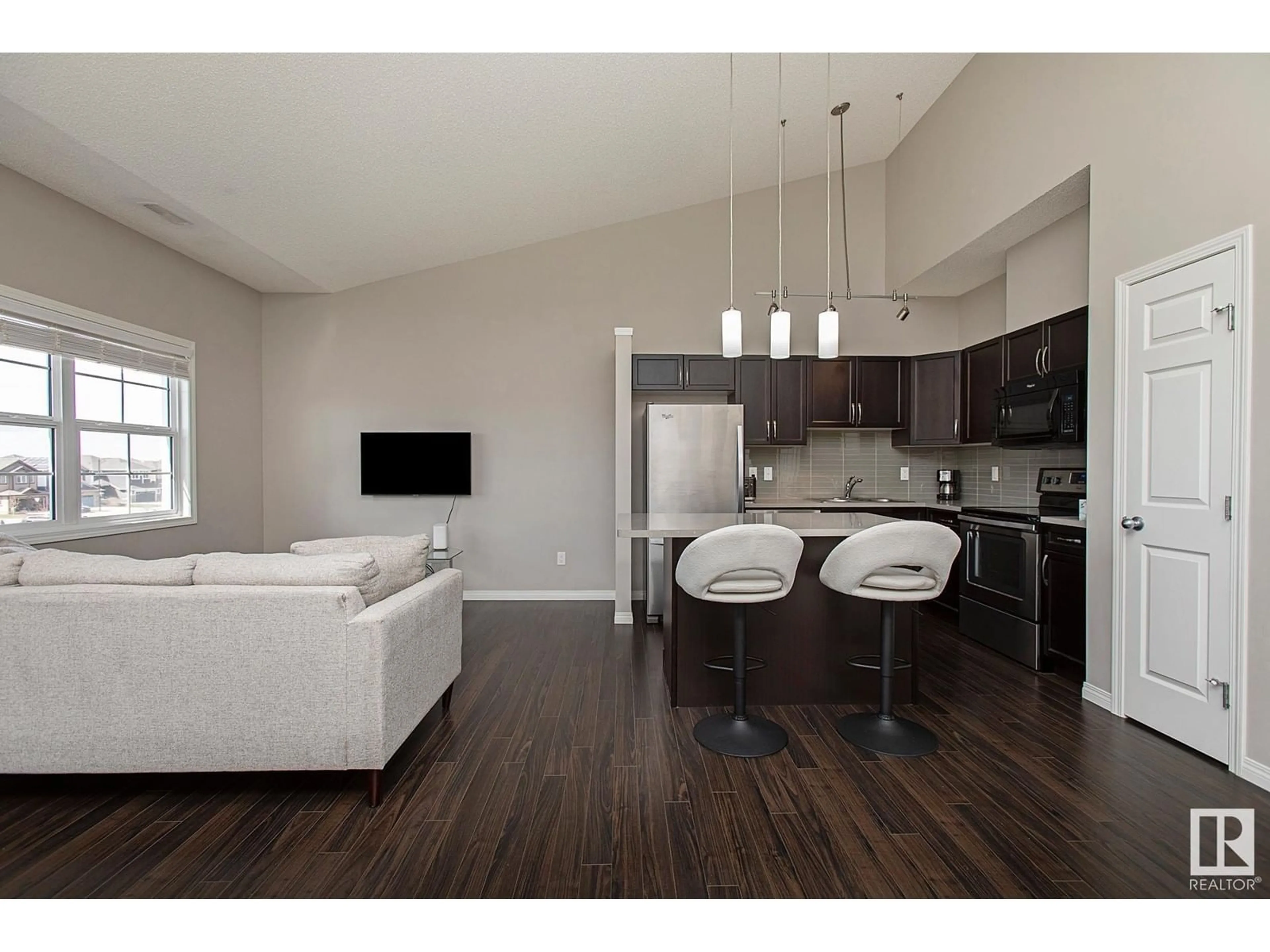 Open concept kitchen, wood/laminate floor for #82 - 4029 ORCHARDS DR, Edmonton Alberta T6X1V2