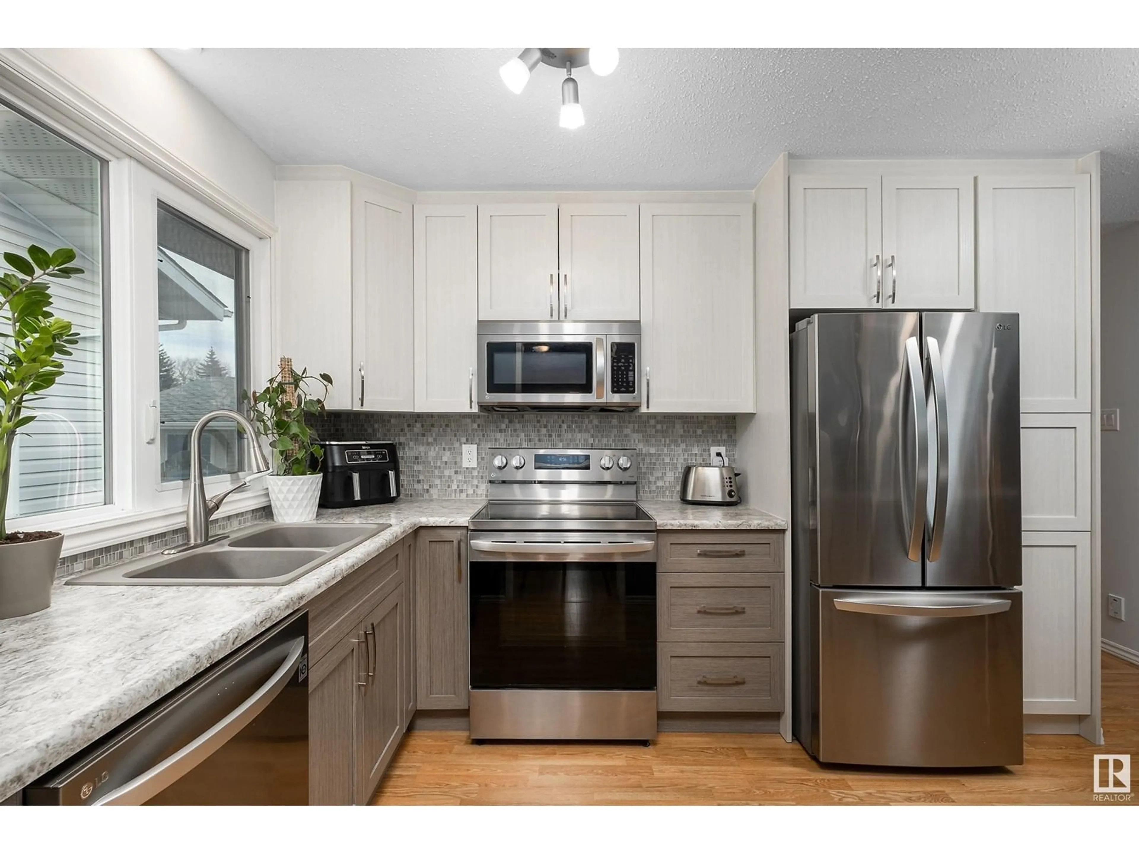 Open concept kitchen, unknown for NW - 1751 62 ST, Edmonton Alberta T6L1M7