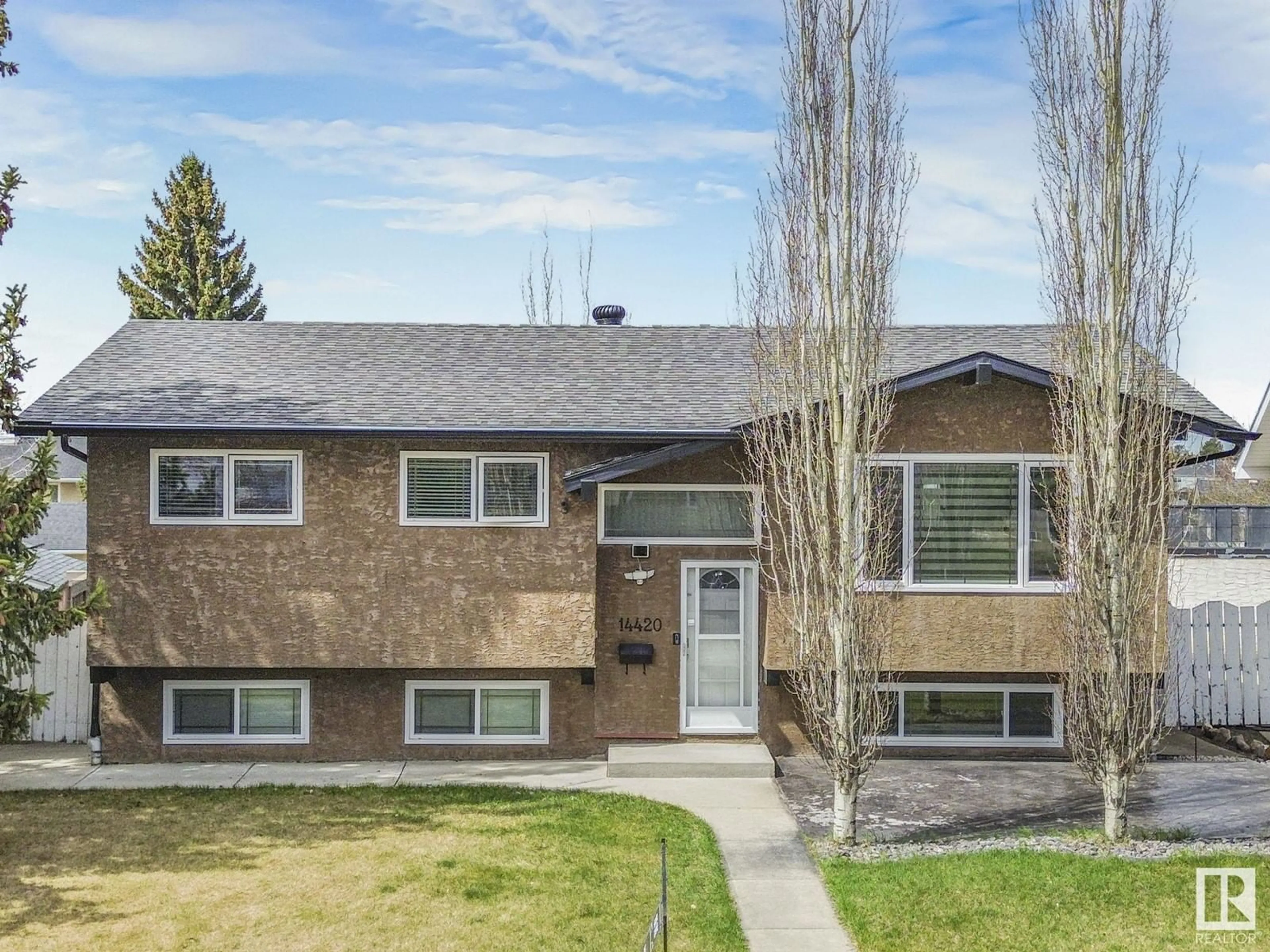 Home with vinyl exterior material, street for 14420 86 ST, Edmonton Alberta T5E3C7