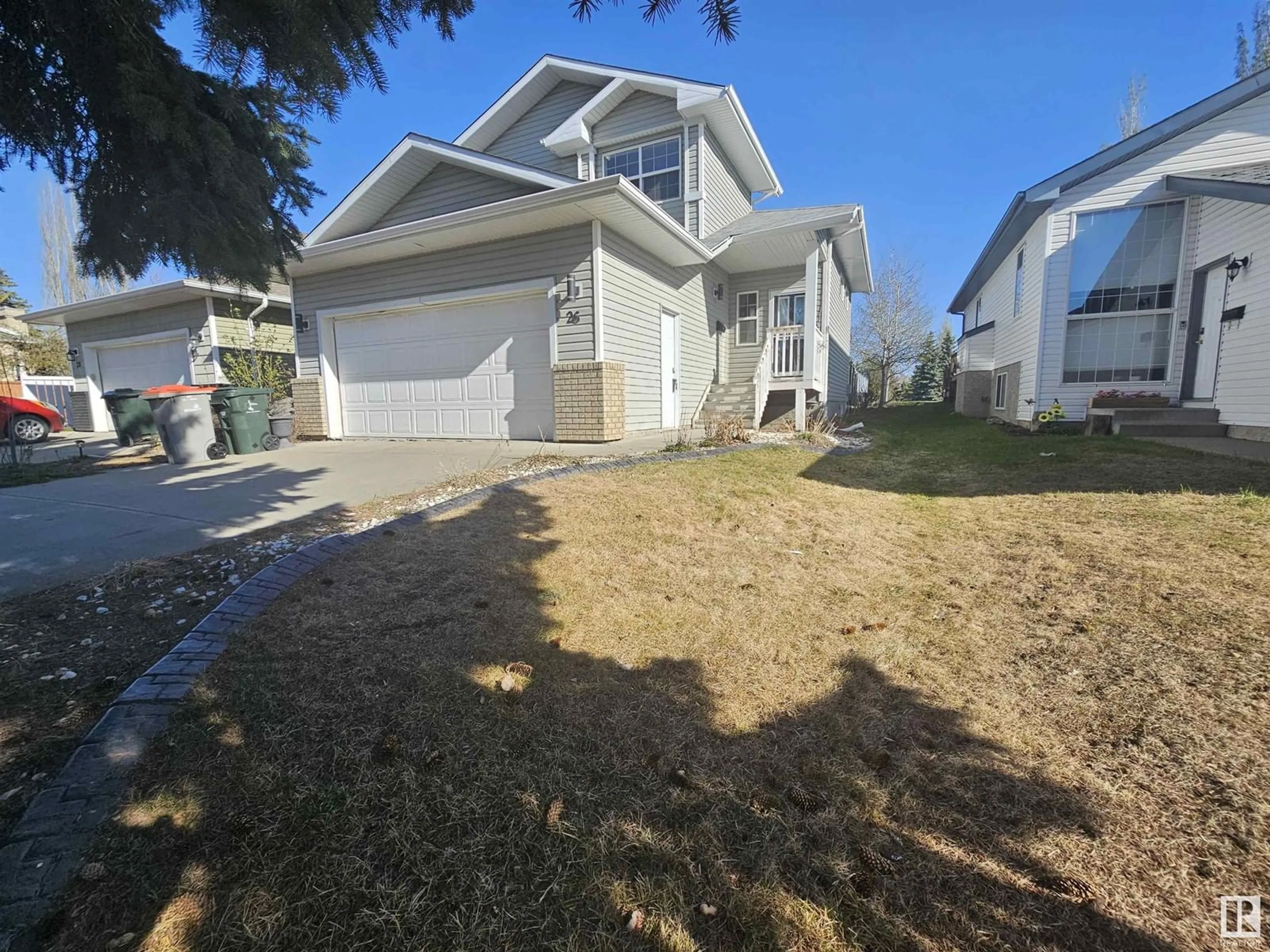 Home with vinyl exterior material, street for 26 HARMONY COURT, Stony Plain Alberta T7Z2A6
