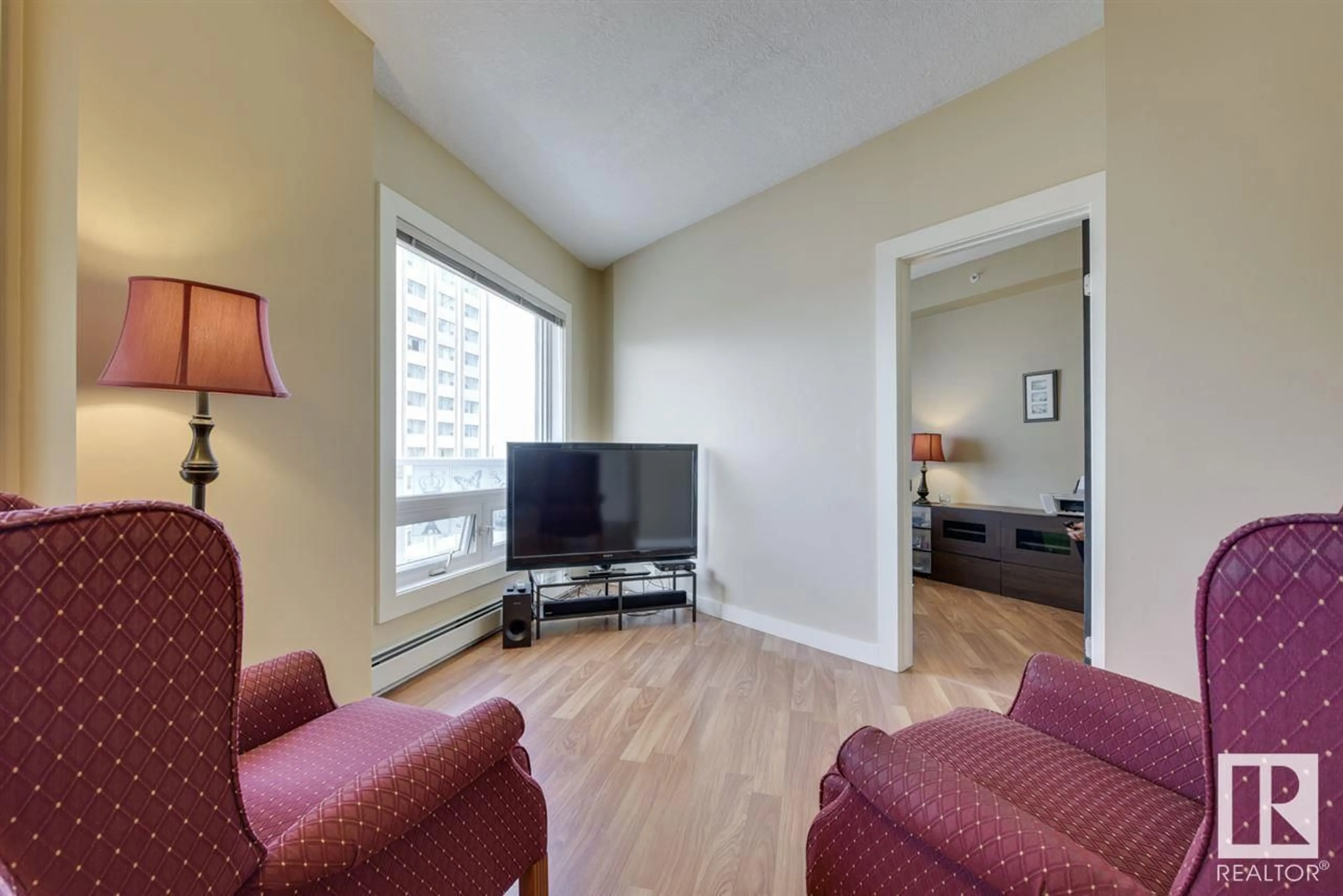 Living room with furniture, wood/laminate floor for 906 10136 104 ST NW, Edmonton Alberta T5J0B5