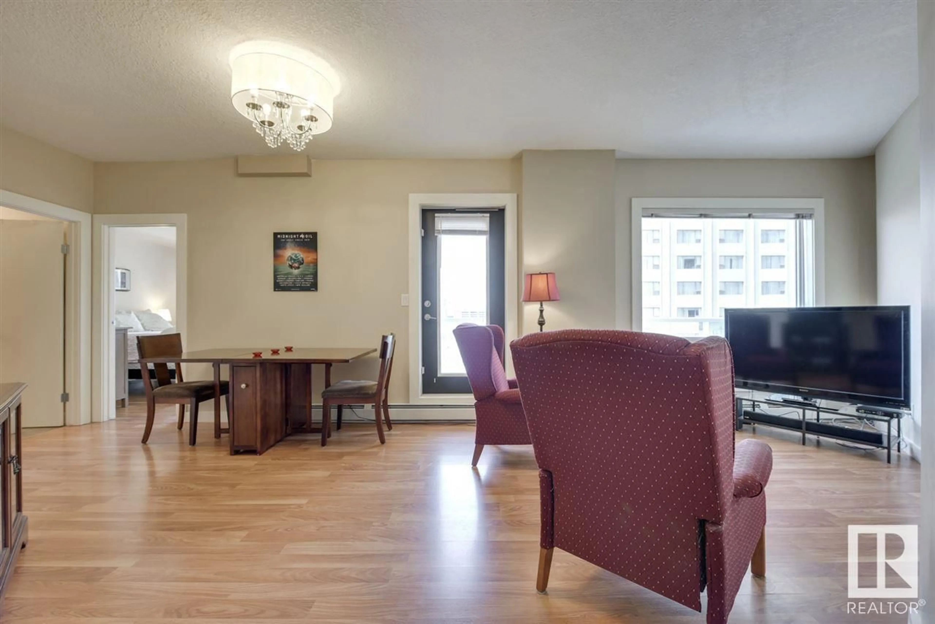 Living room with furniture, wood/laminate floor for 906 10136 104 ST NW, Edmonton Alberta T5J0B5