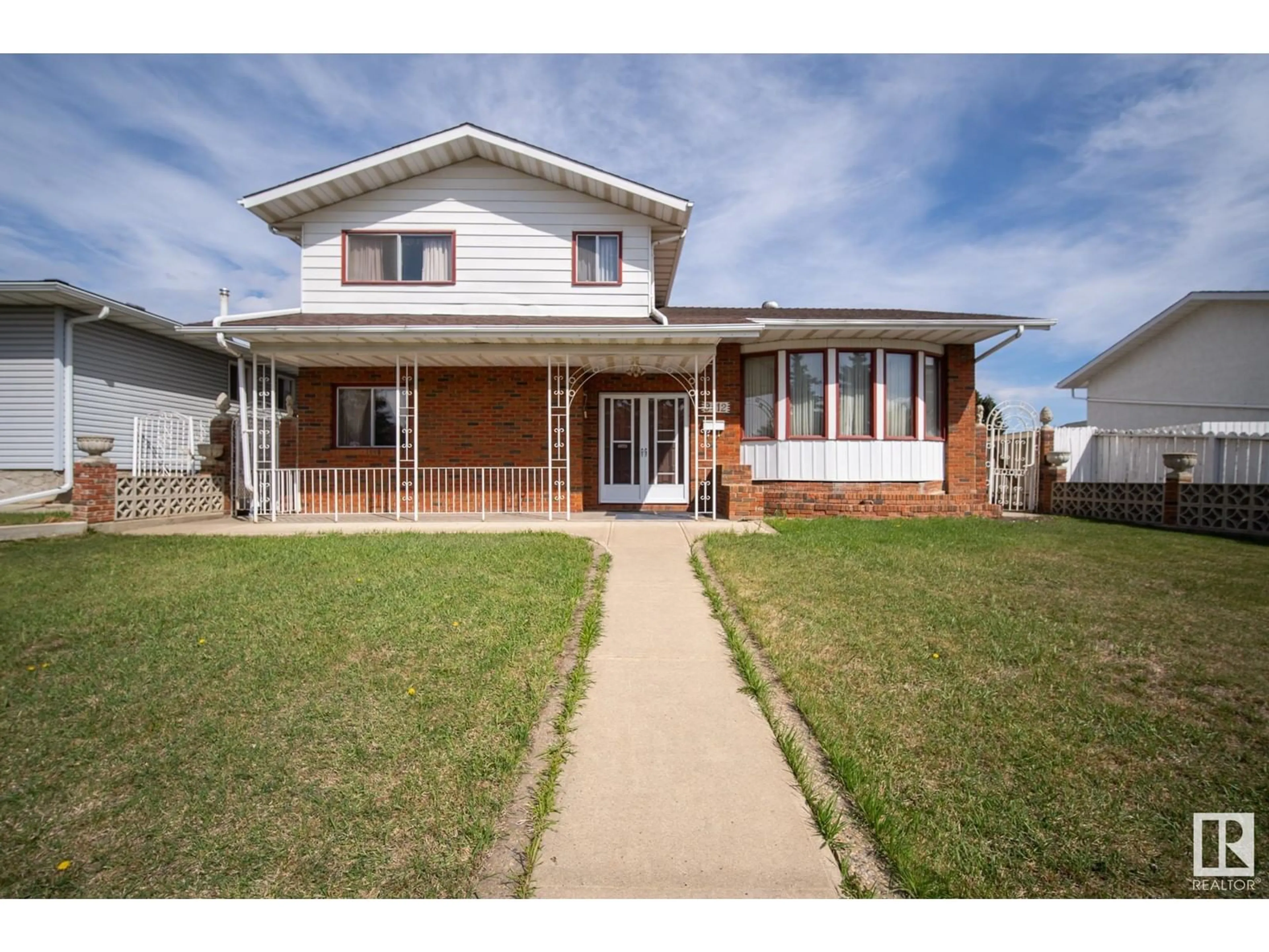 Home with vinyl exterior material, street for 9412 138 AV, Edmonton Alberta T5E6A8