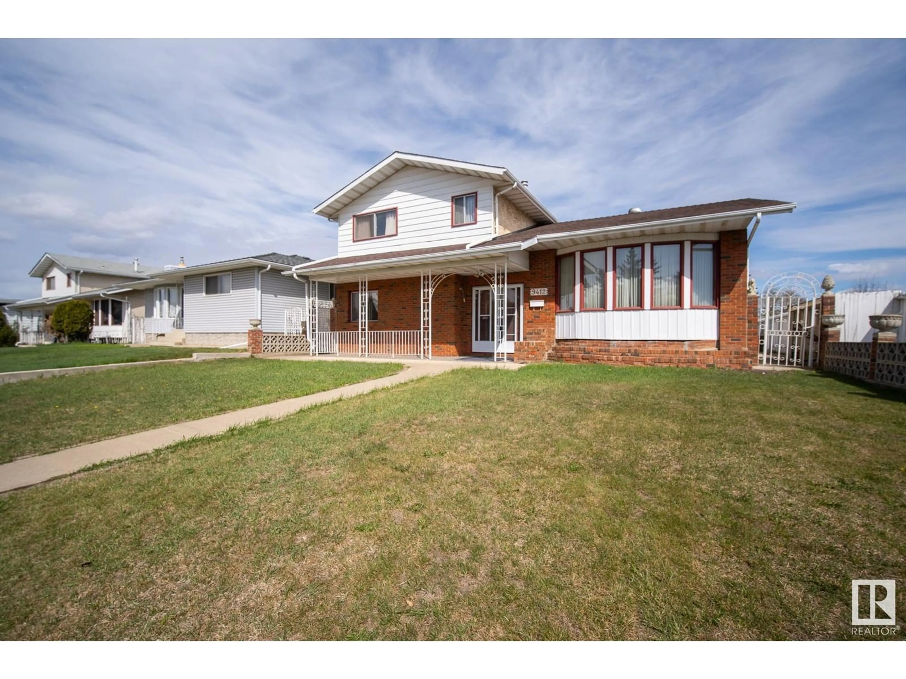 Home with brick exterior material, street for 9412 138 AV, Edmonton Alberta T5E6A8