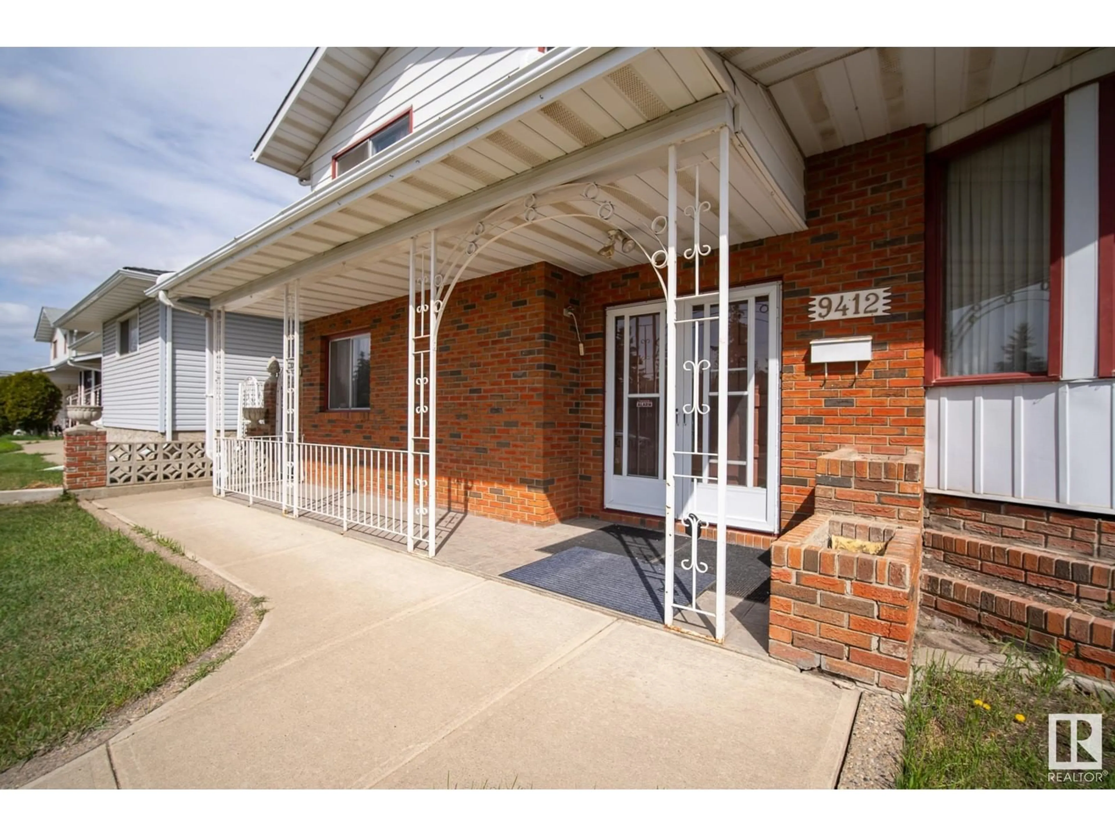 Home with brick exterior material, street for 9412 138 AV, Edmonton Alberta T5E6A8