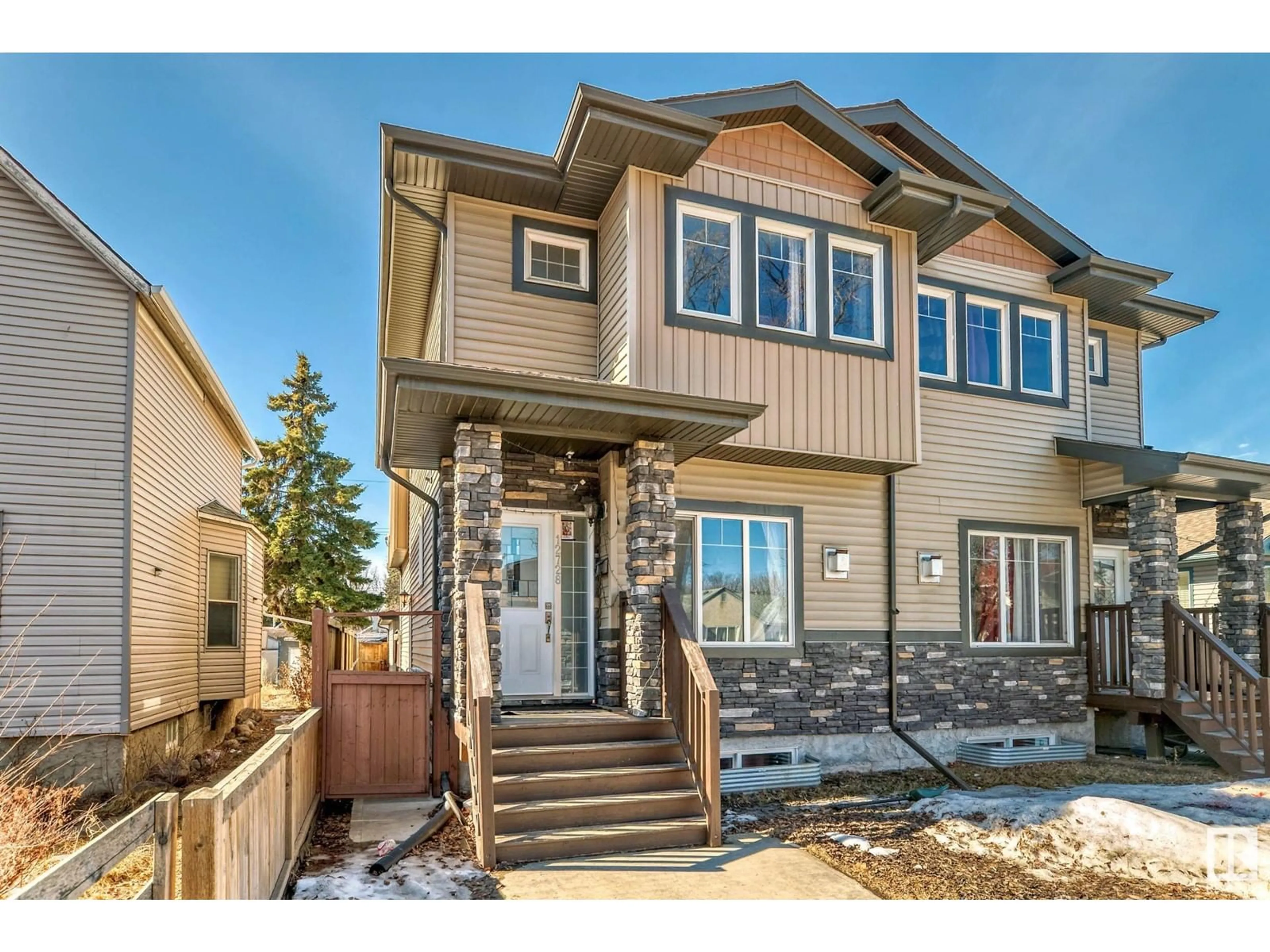 Home with vinyl exterior material, street for 12728 118 ST, Edmonton Alberta T5E5K8