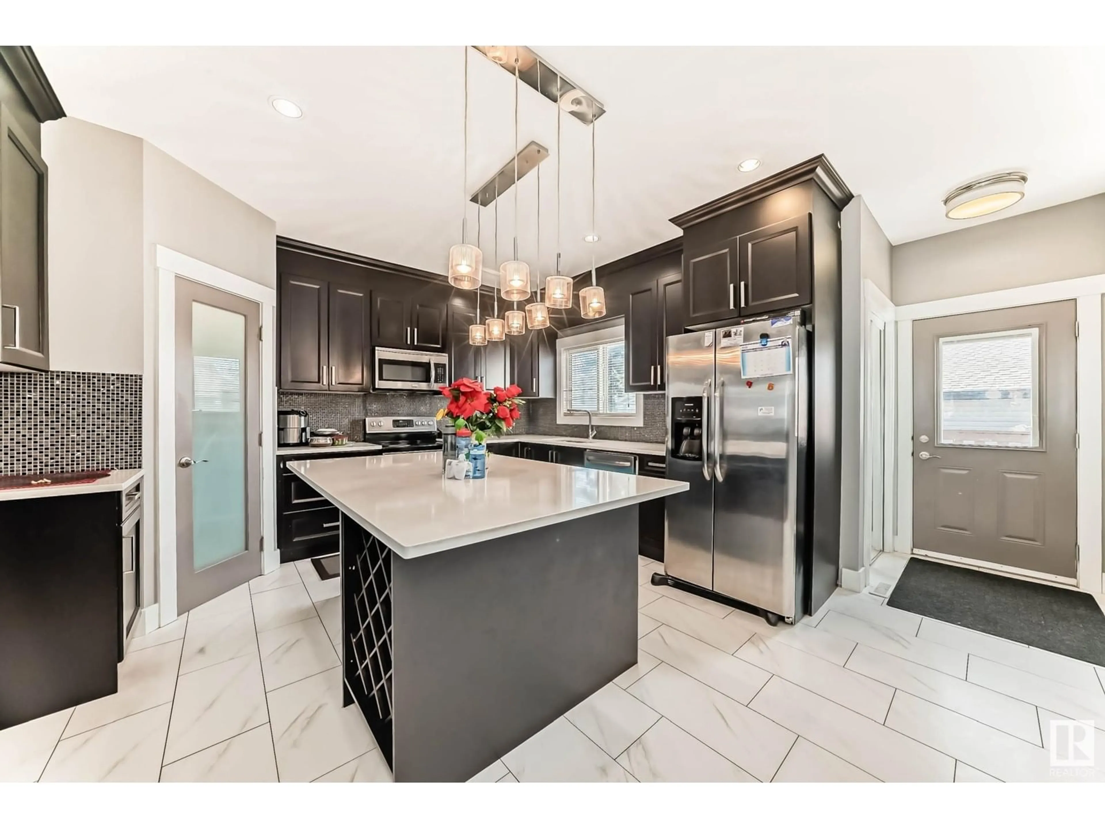 Open concept kitchen, ceramic/tile floor for 12728 118 ST, Edmonton Alberta T5E5K8