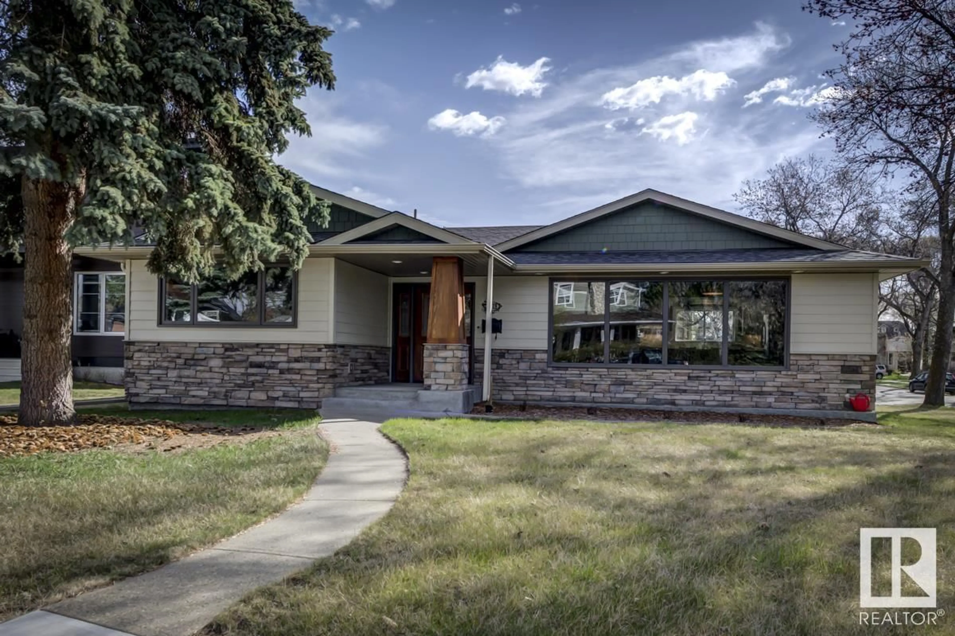 Home with vinyl exterior material, street for 5318 111 AV, Edmonton Alberta T5W0K5