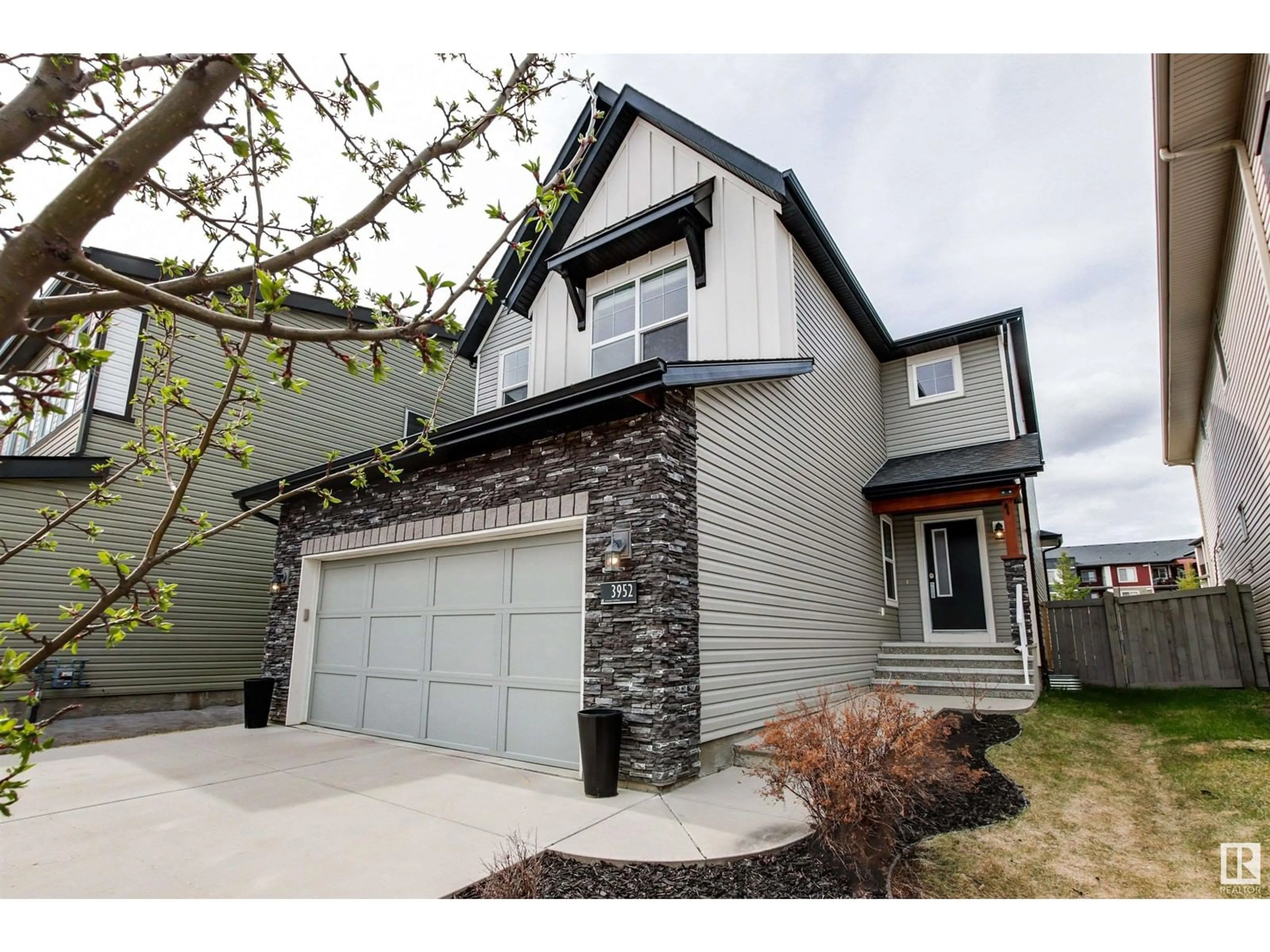 Home with vinyl exterior material, street for SW - 3952 CLAXTON LO, Edmonton Alberta T6W1Y7
