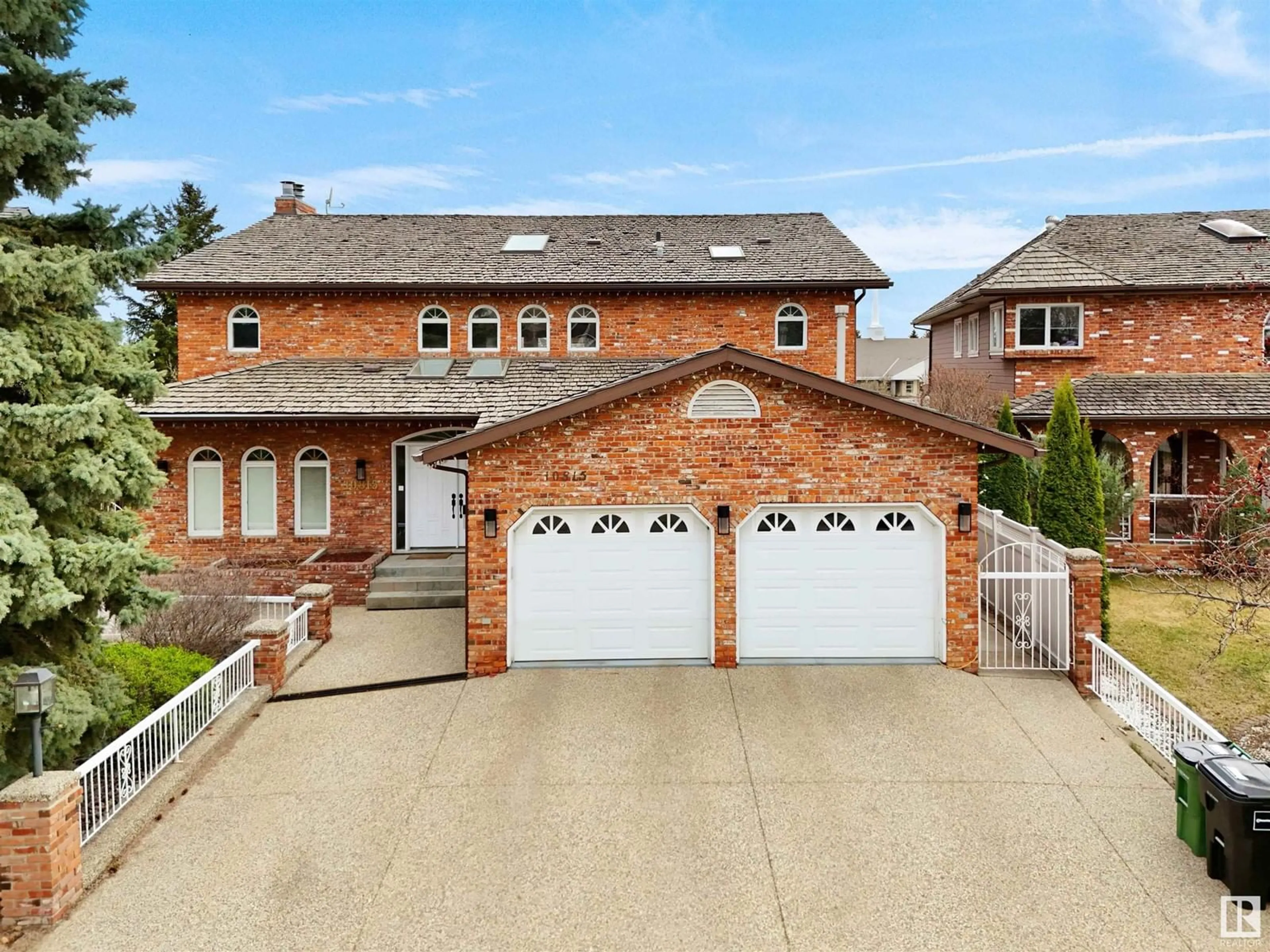 Home with brick exterior material, street for 10815 BEARSPAW E NW, Edmonton Alberta T6J5E1