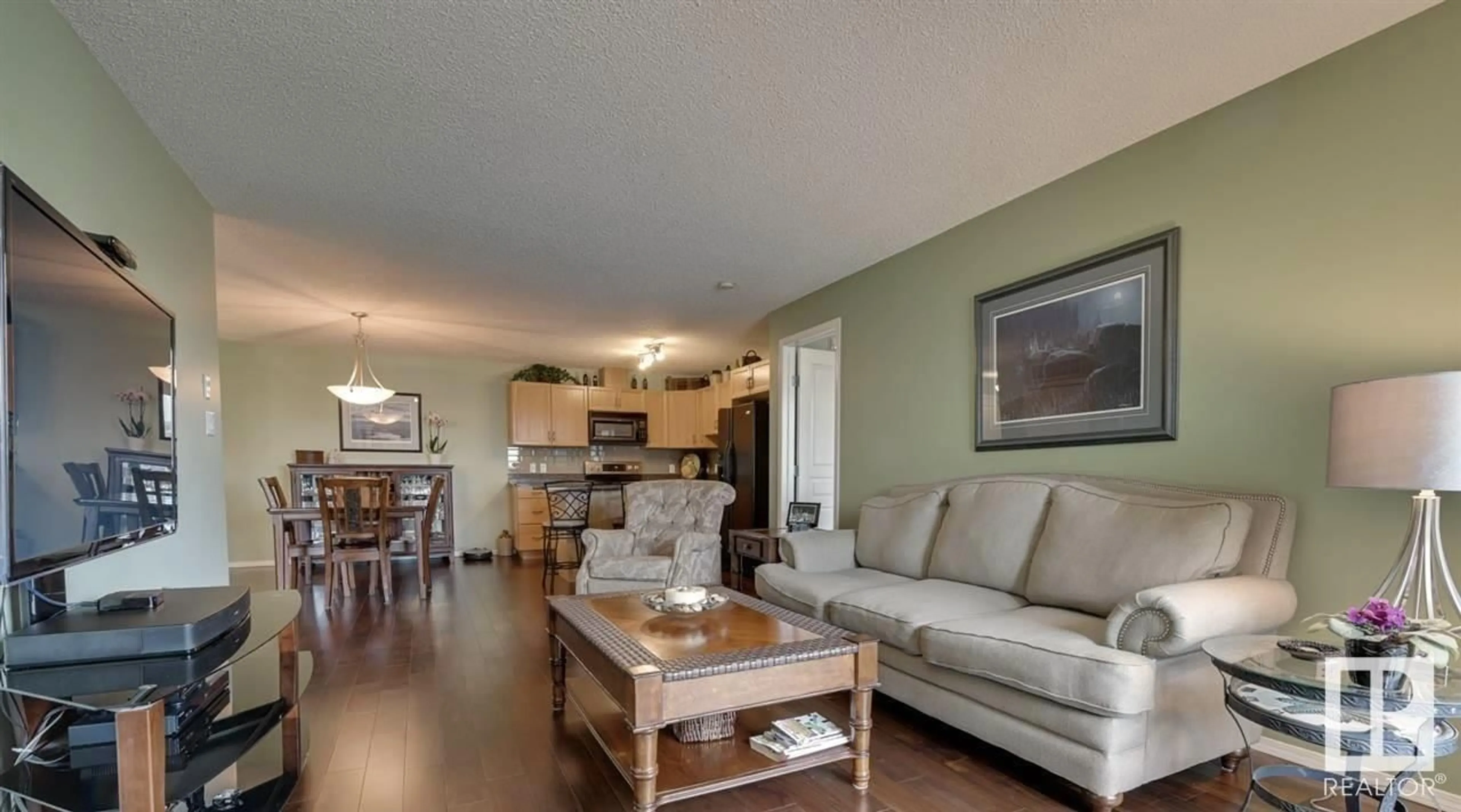 Living room with furniture, wood/laminate floor for 429 16035 132 ST NW, Edmonton Alberta T6V0B4
