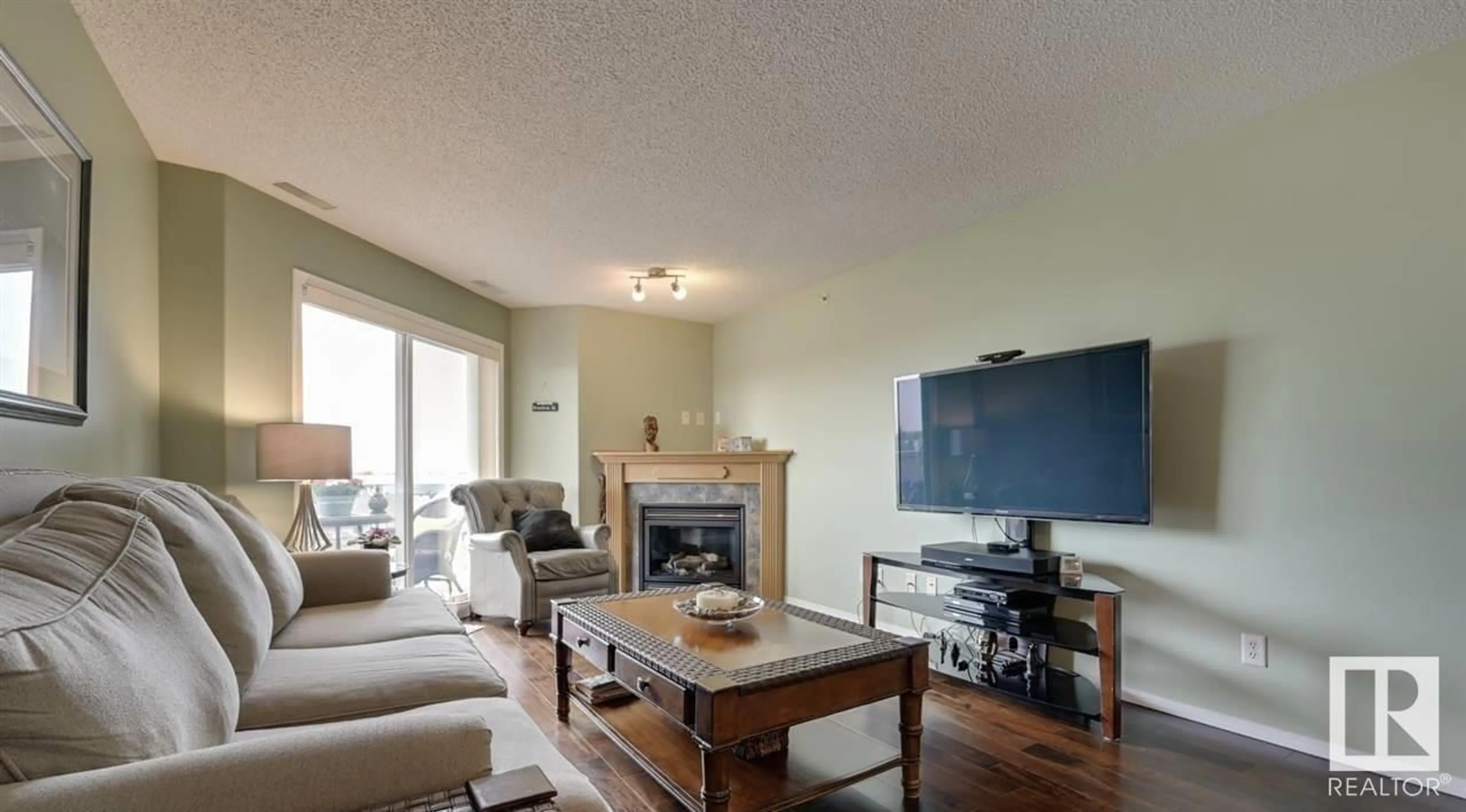 Living room with furniture, wood/laminate floor for 429 16035 132 ST NW, Edmonton Alberta T6V0B4