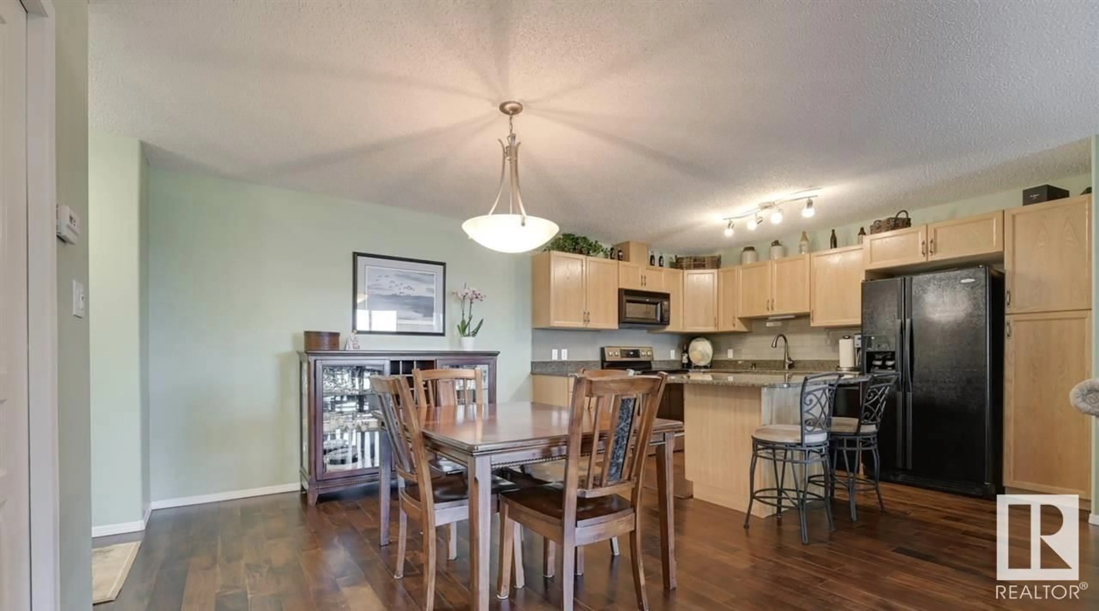 Open concept kitchen, wood/laminate floor for 429 16035 132 ST NW, Edmonton Alberta T6V0B4