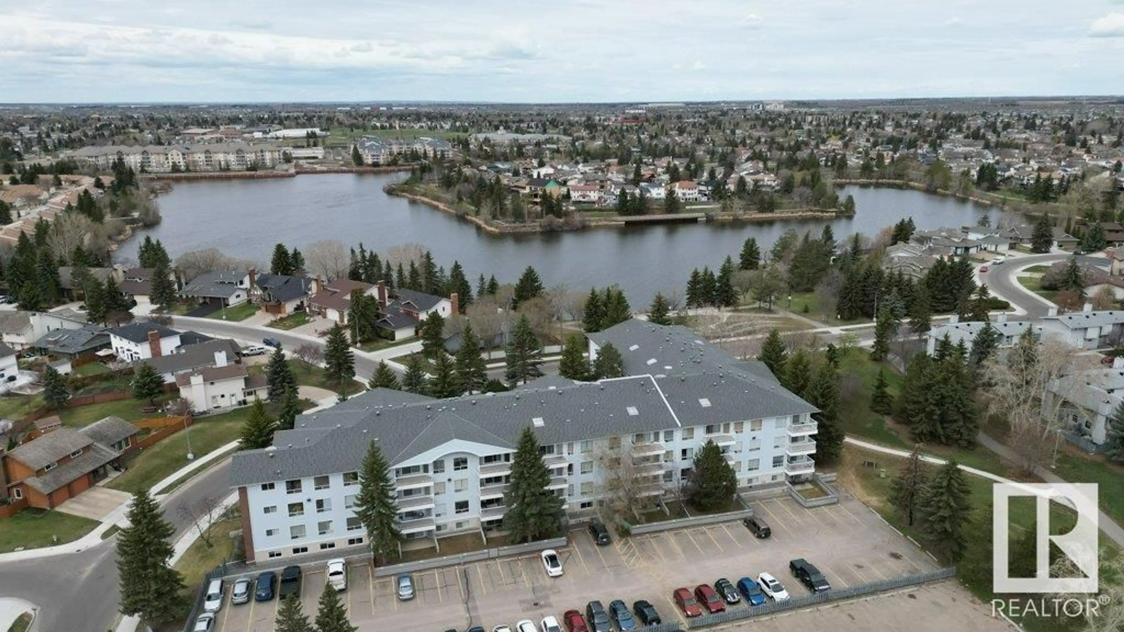A pic from outside/outdoor area/front of a property/back of a property/a pic from drone, water/lake/river/ocean view for 101 15503 106 ST NW, Edmonton Alberta T5X5W7