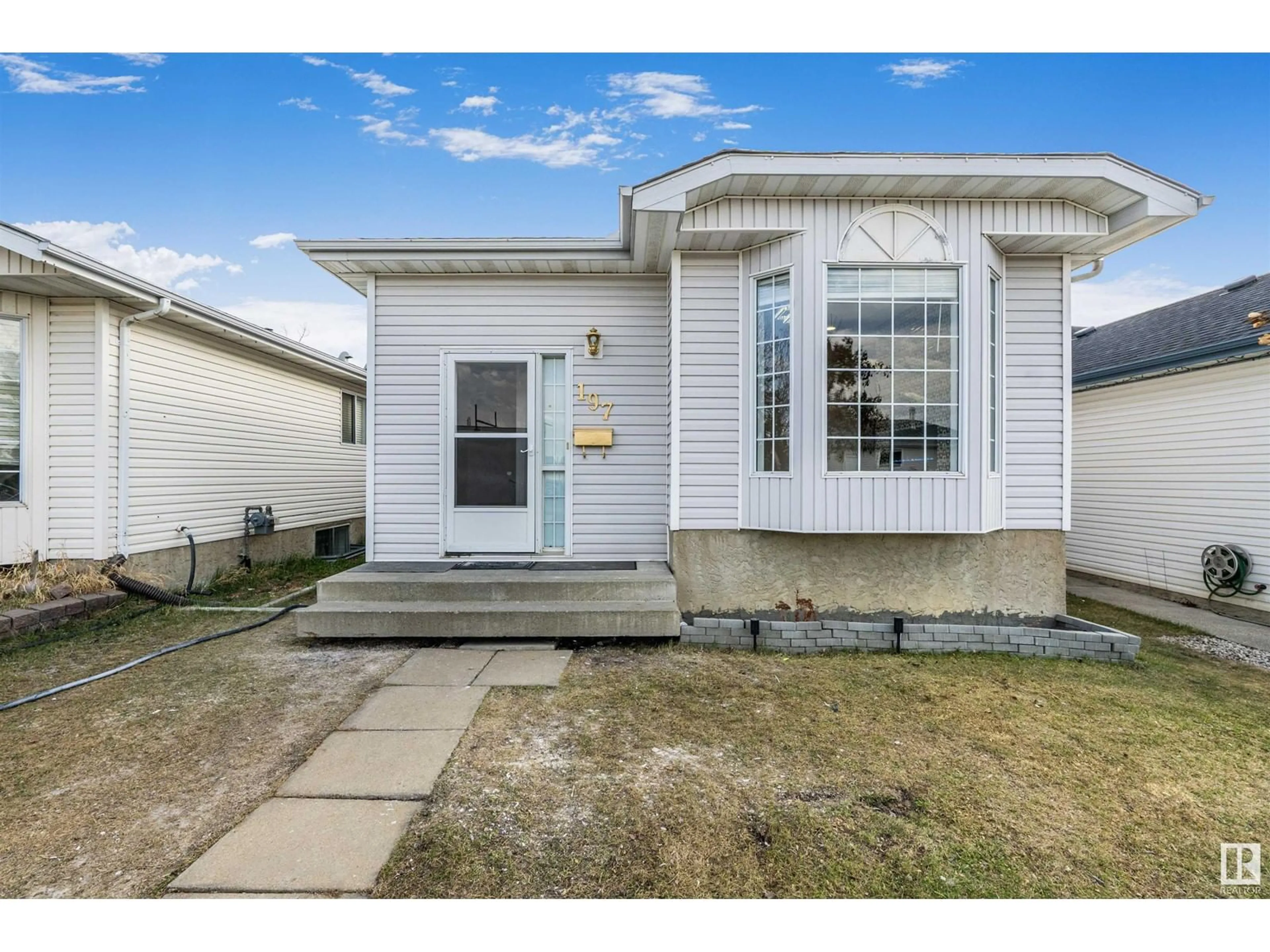 Home with vinyl exterior material, street for 197 KIRKWOOD AVENUE, Edmonton Alberta T6L6K7