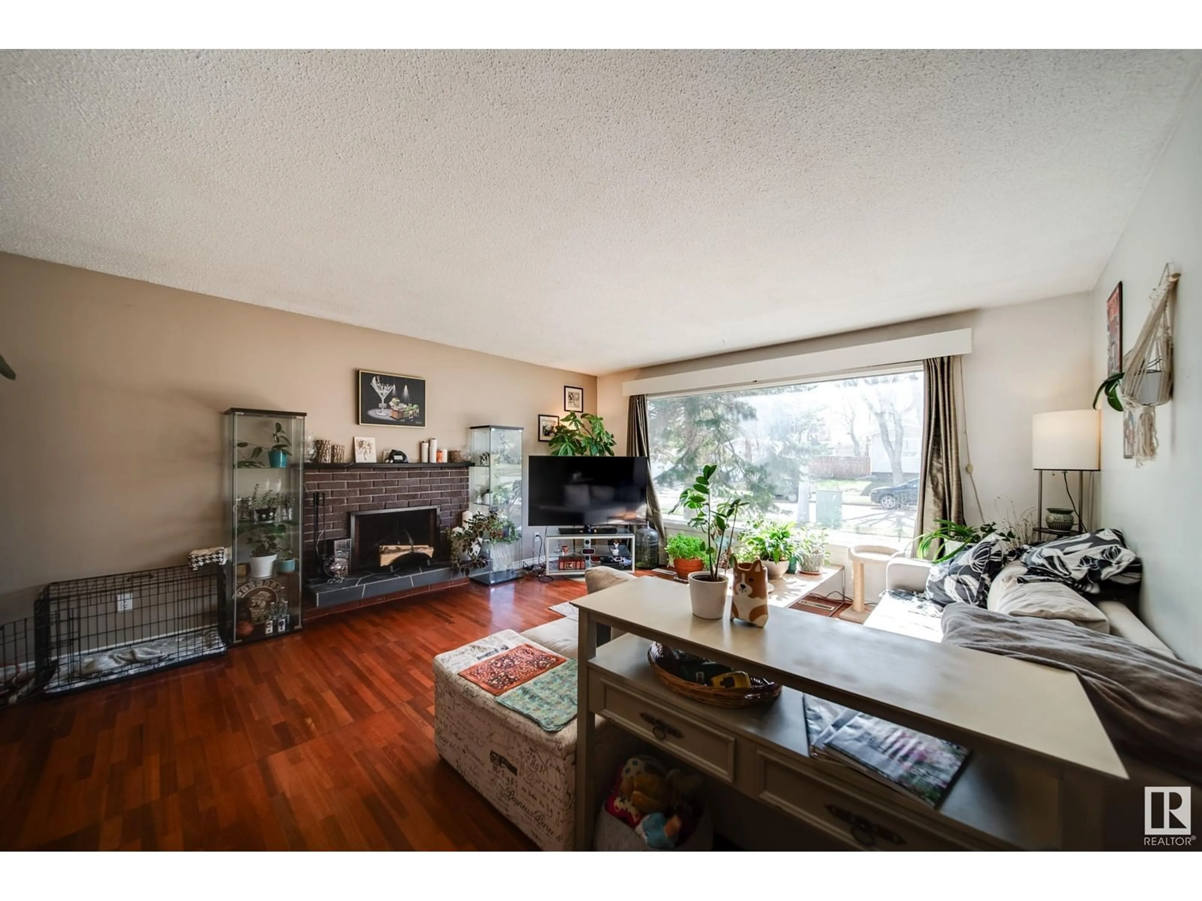 Living room with furniture, wood/laminate floor for 9621 89B ST, Fort Saskatchewan Alberta T8L1J8