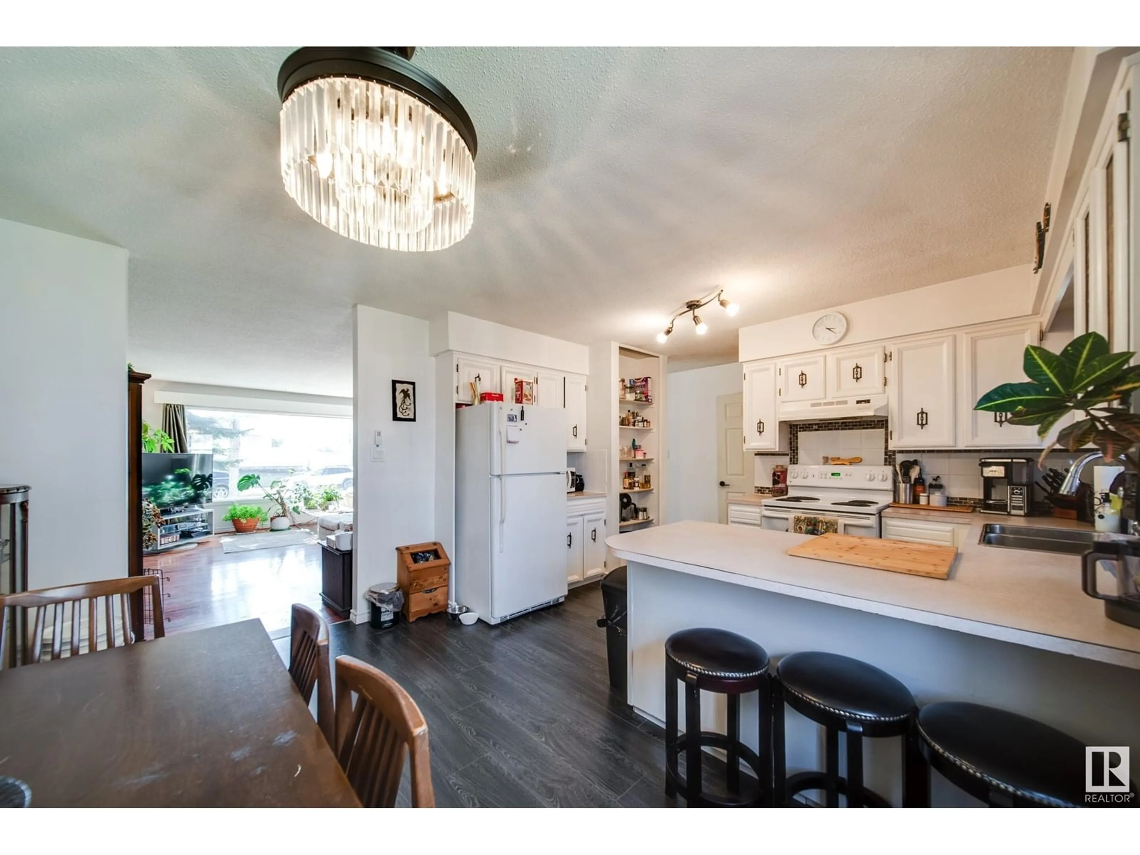 Open concept kitchen, wood/laminate floor for 9621 89B ST, Fort Saskatchewan Alberta T8L1J8